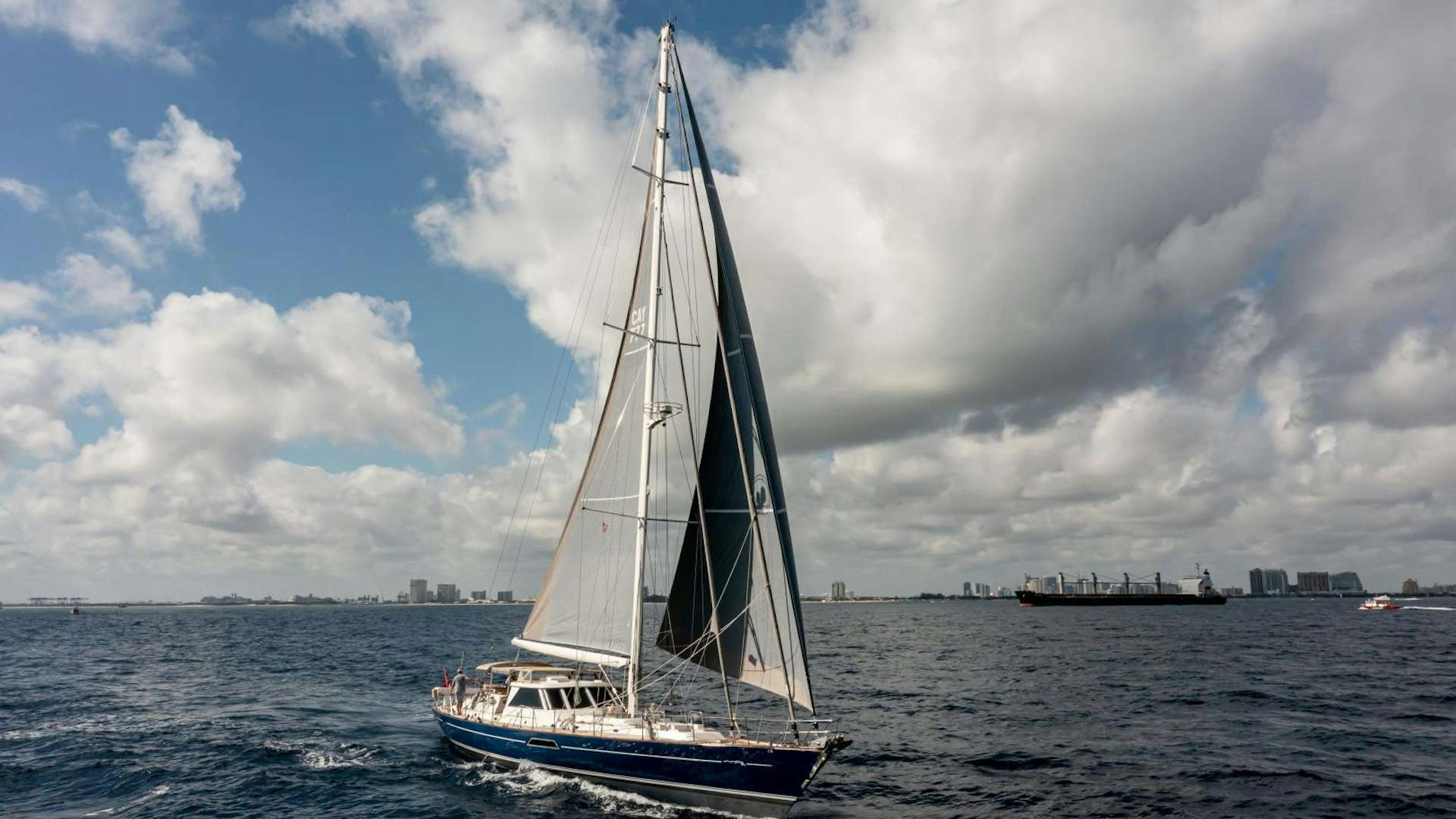a sailboat on the water aboard Mustang Yacht for Sale