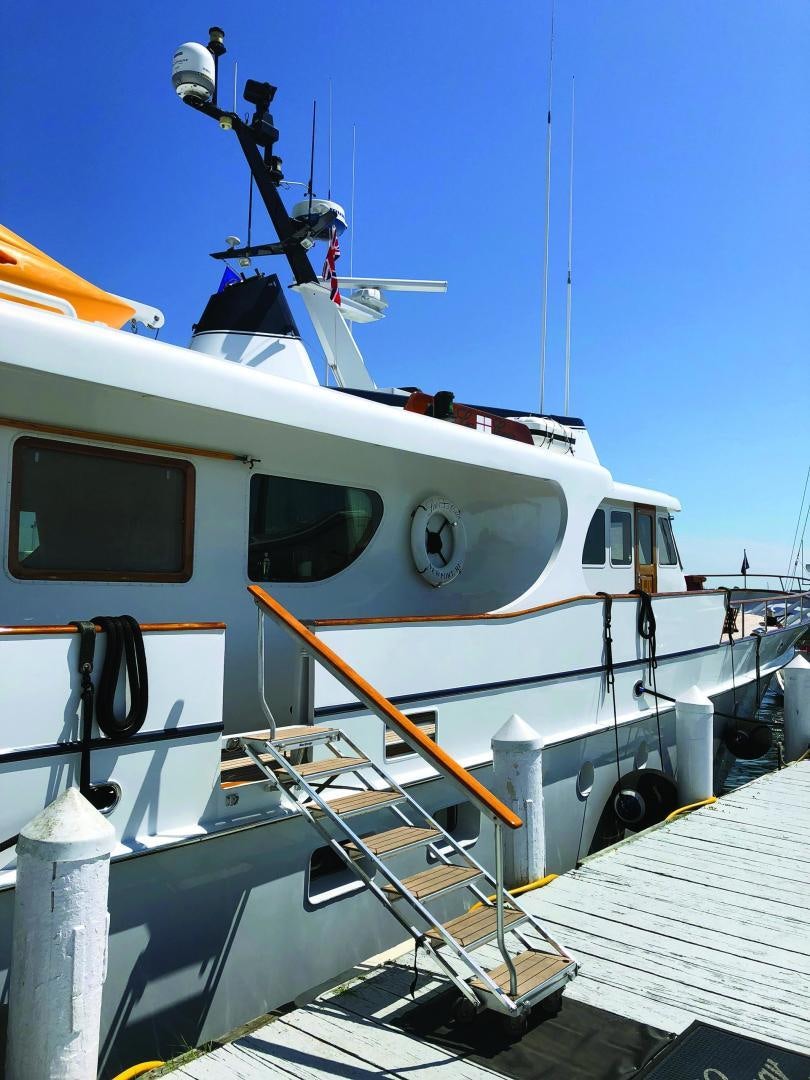 a boat docked at a pier aboard SEA CZAR Yacht for Sale