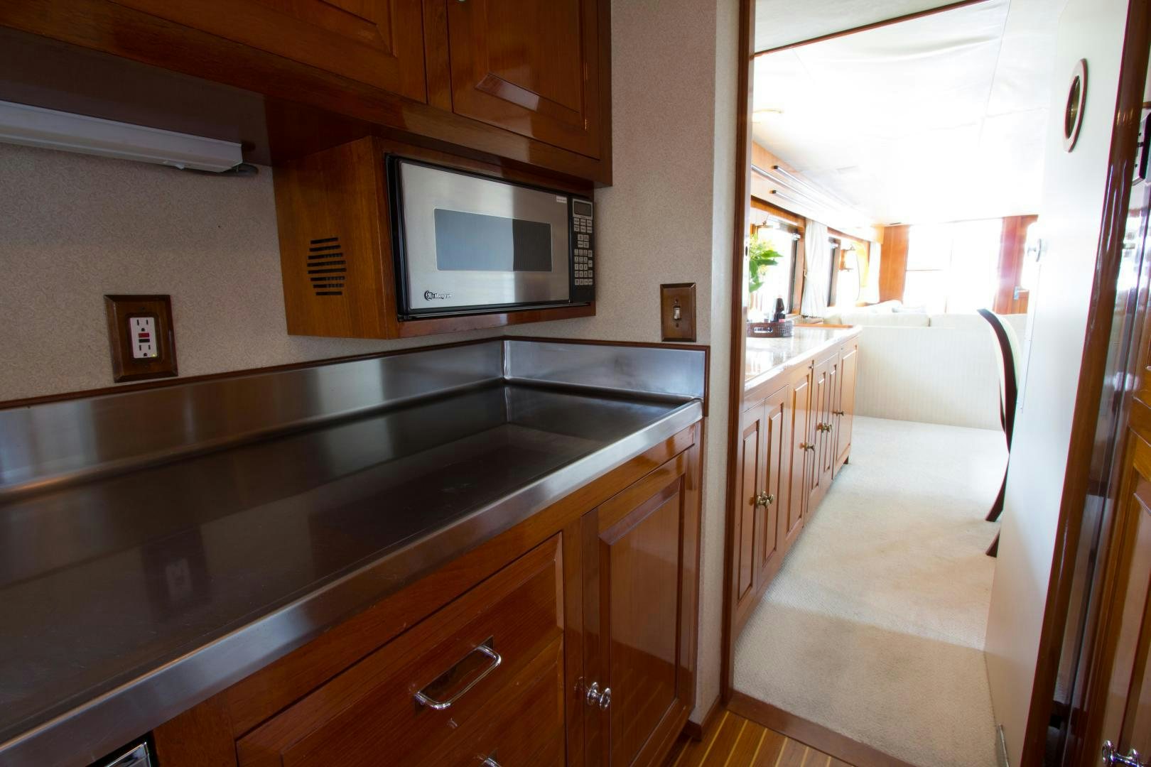 a kitchen with a microwave oven aboard SEA CZAR Yacht for Sale