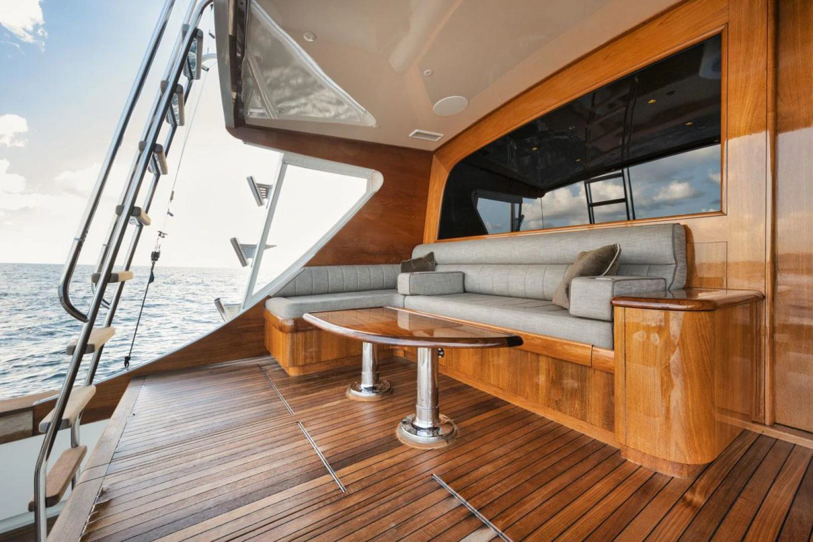 a living room with a couch and a ladder aboard OWL'S NEST Yacht for Sale