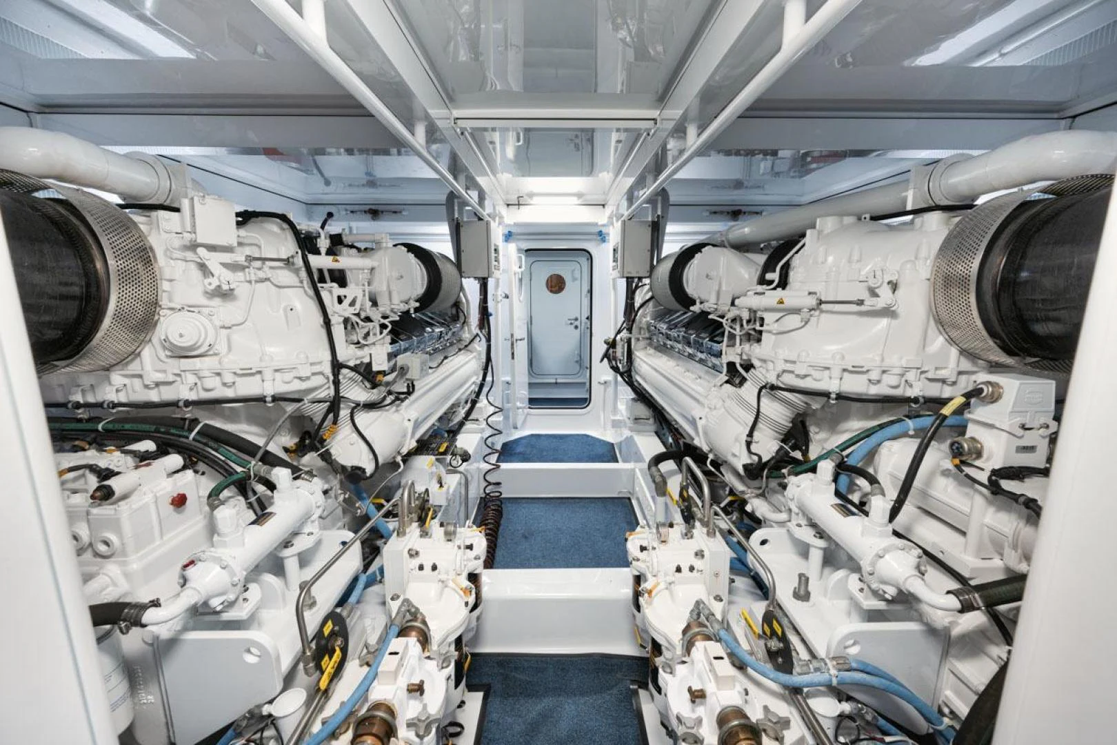 a large white machine with many pipes aboard OWL'S NEST Yacht for Sale