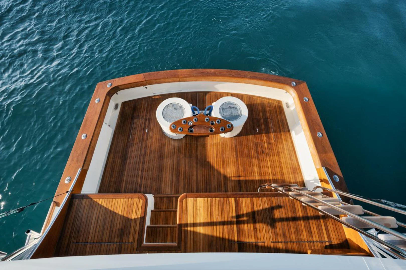 a wooden boat with a wooden paddle aboard OWL'S NEST Yacht for Sale