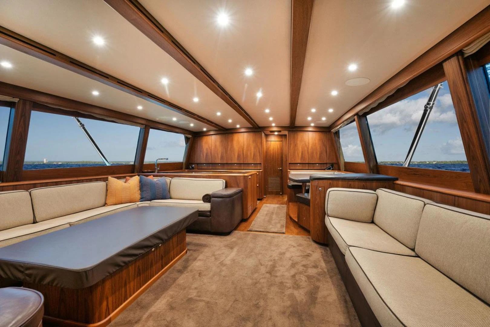 a large room with a bed and a couch aboard OWL'S NEST Yacht for Sale