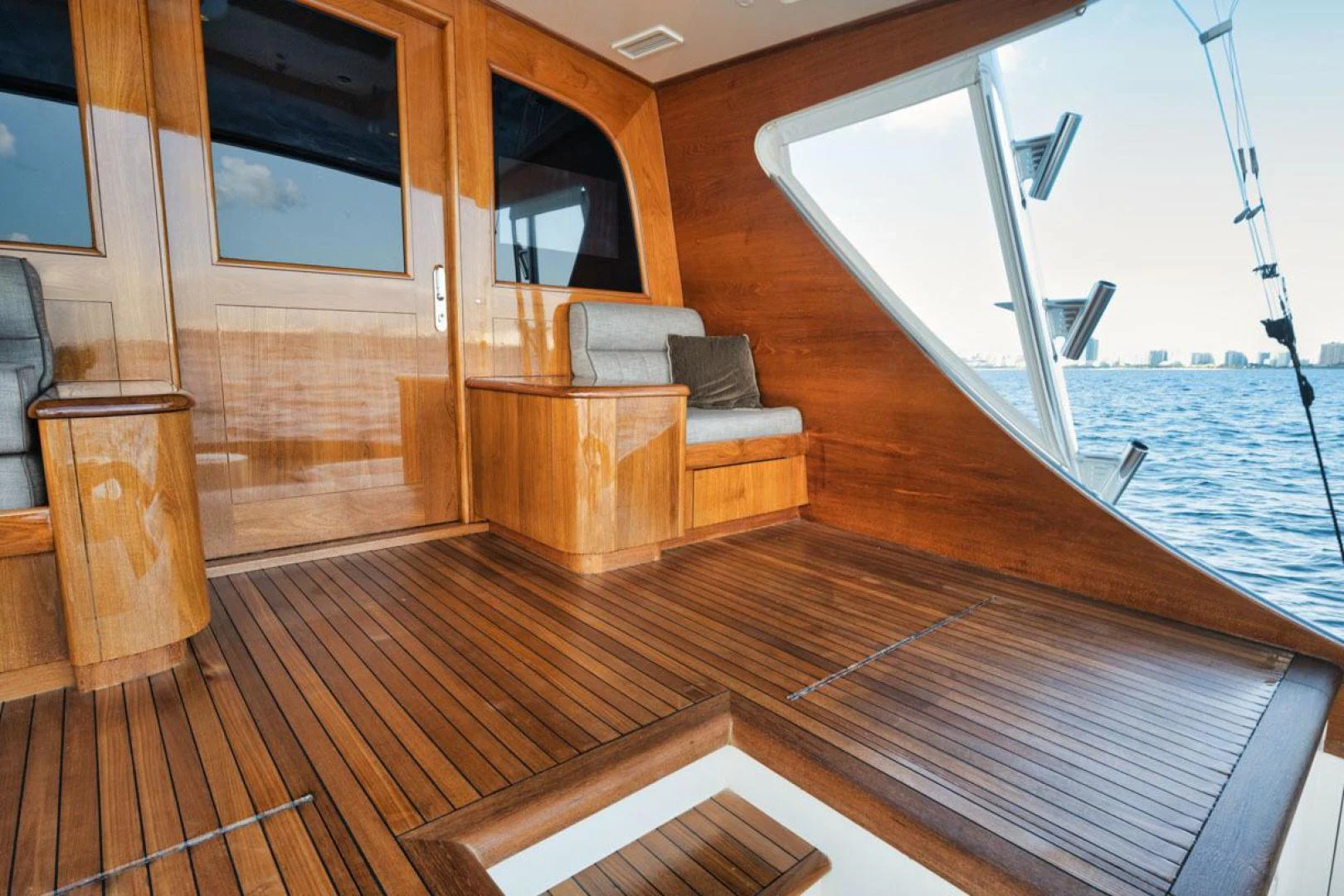a deck with a couch and a large body of water aboard OWL'S NEST Yacht for Sale