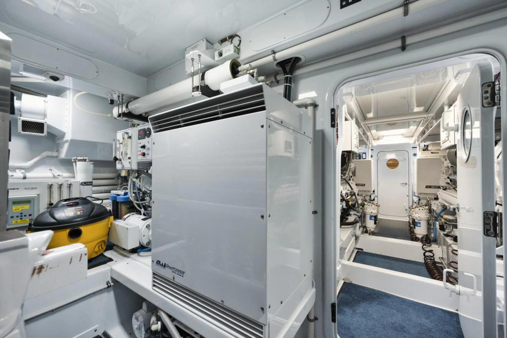 a large machine in a room aboard OWL'S NEST Yacht for Sale