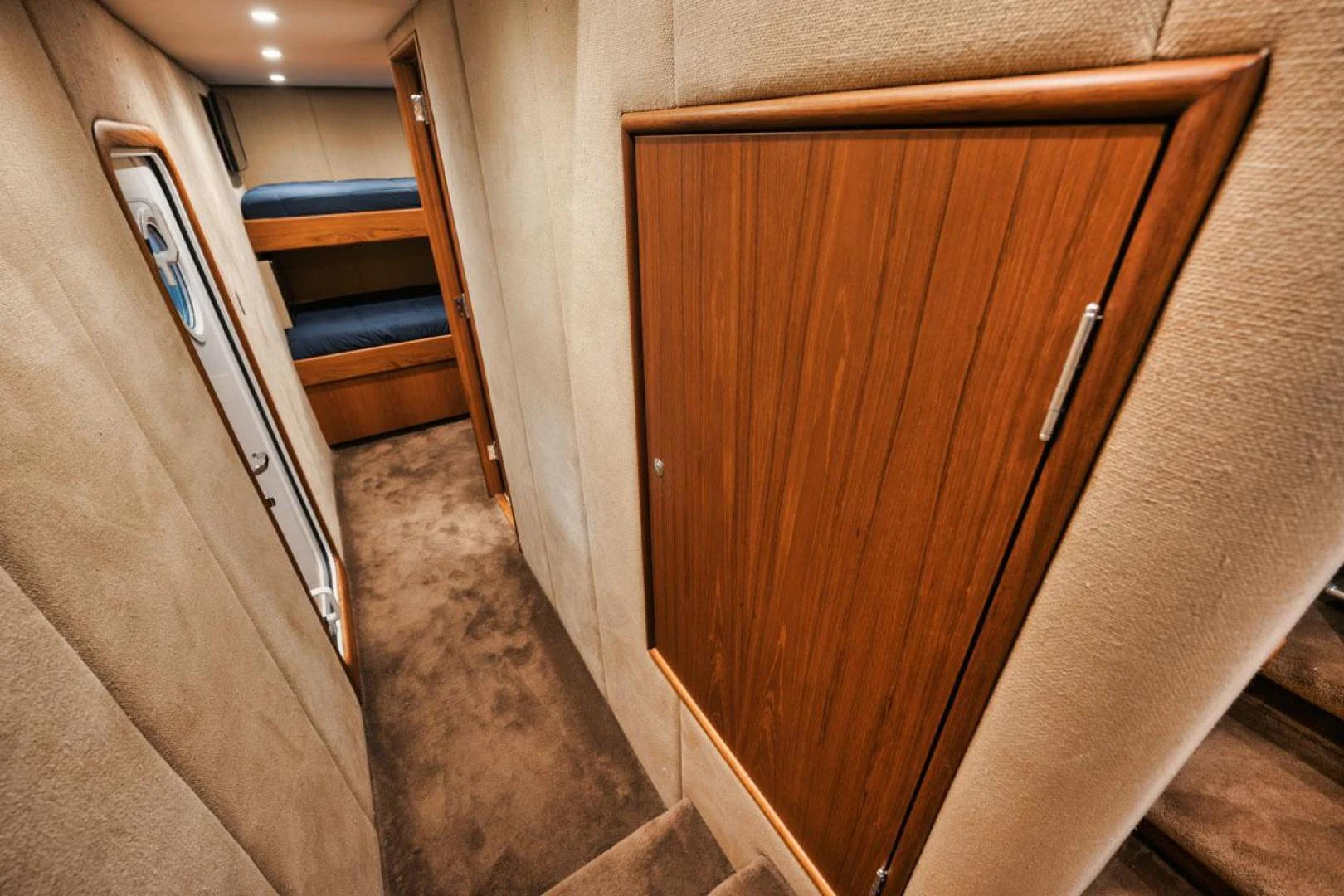 a wooden door in a room aboard OWL'S NEST Yacht for Sale