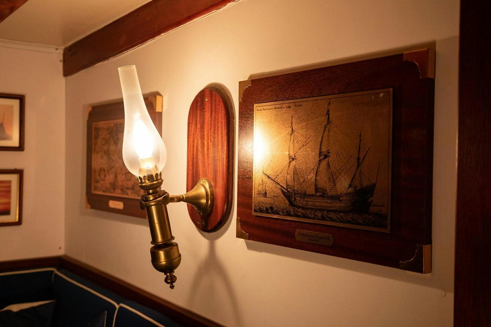 a framed painting on a wall aboard SKYTHIA Yacht for Sale