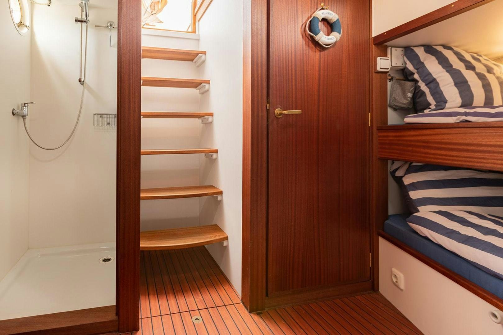 a closet with a bed and a closet aboard SKYTHIA Yacht for Sale