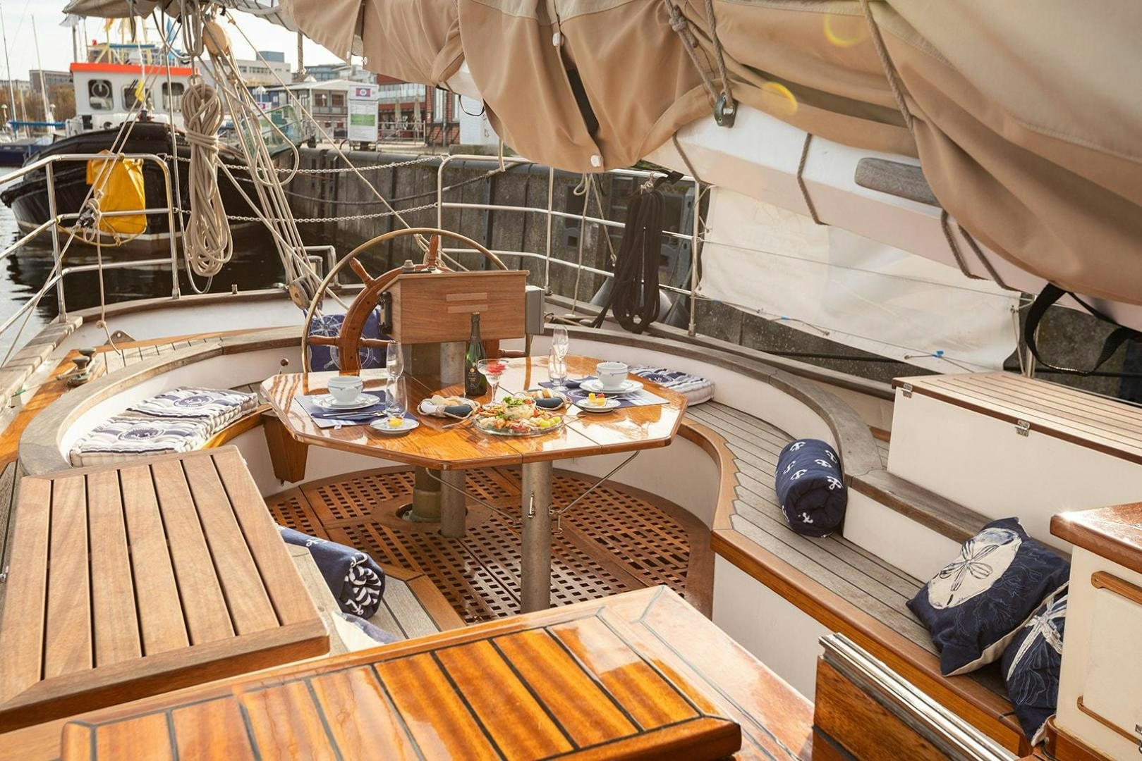 a tent with a table and chairs aboard SKYTHIA Yacht for Sale