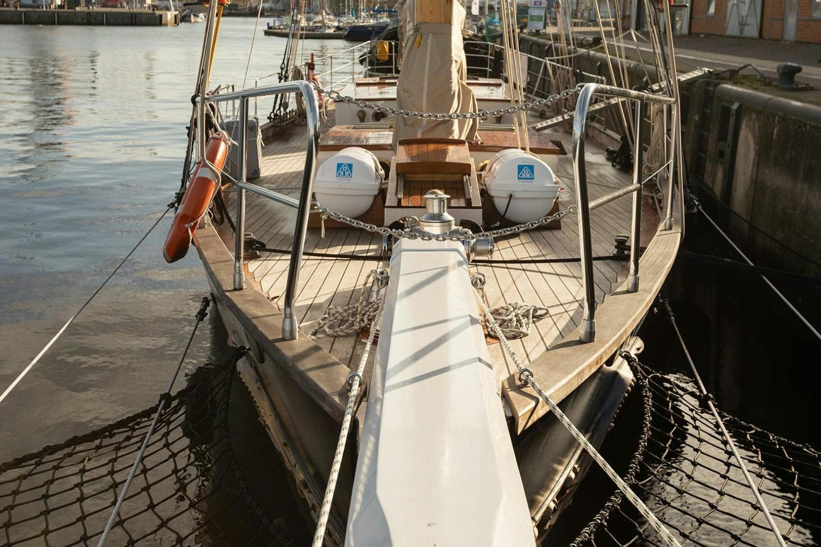 a boat docked at a pier aboard SKYTHIA Yacht for Sale