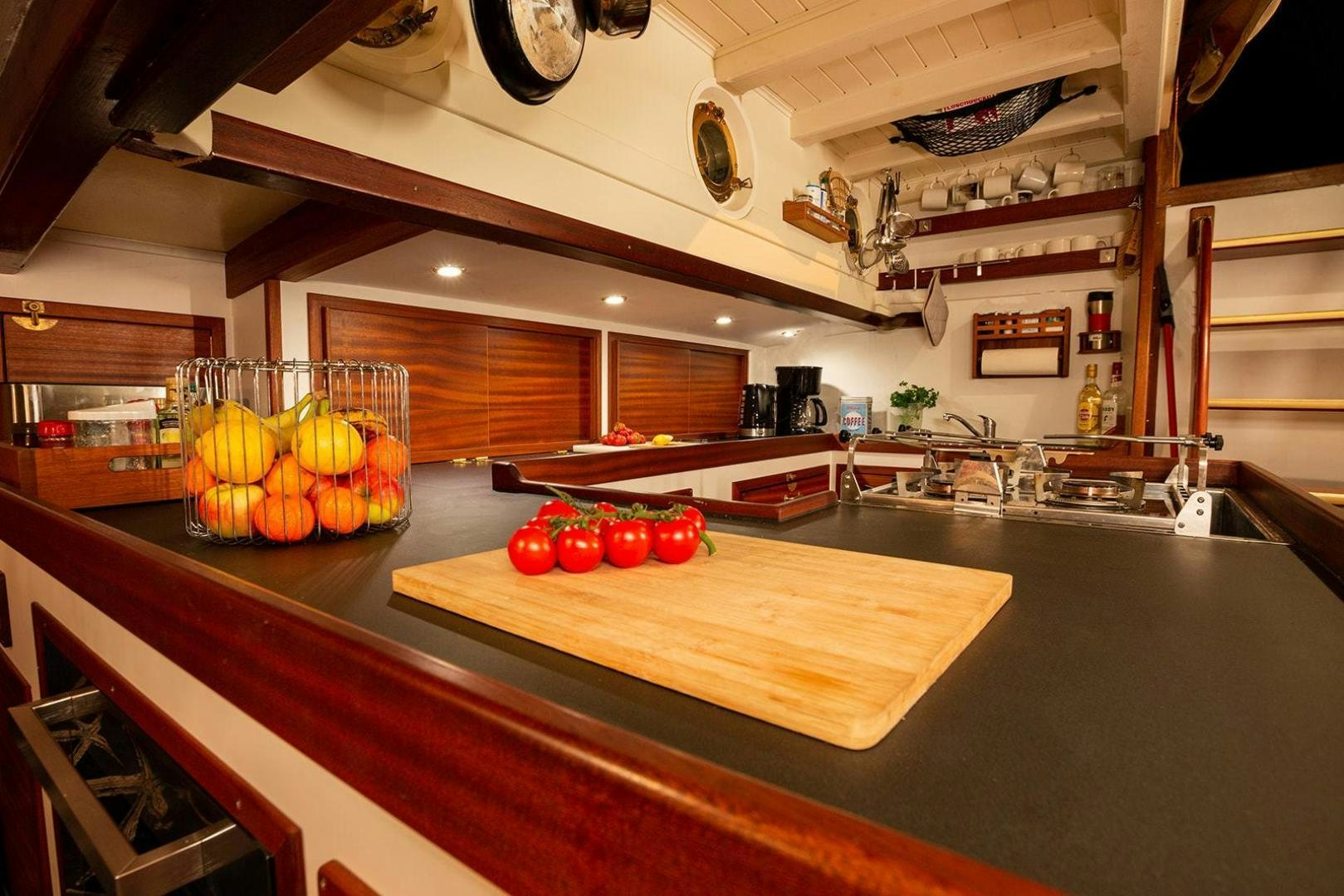 a kitchen with a large island aboard SKYTHIA Yacht for Sale