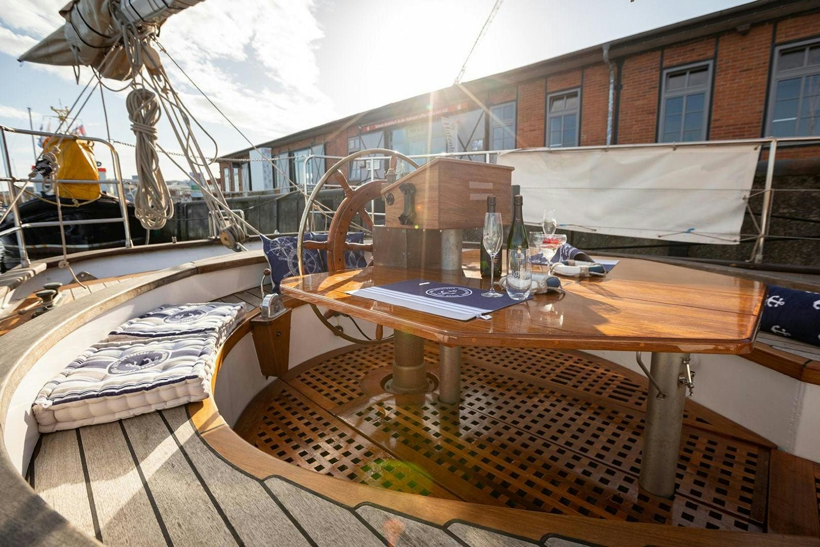 a large boat on a wooden table aboard SKYTHIA Yacht for Sale