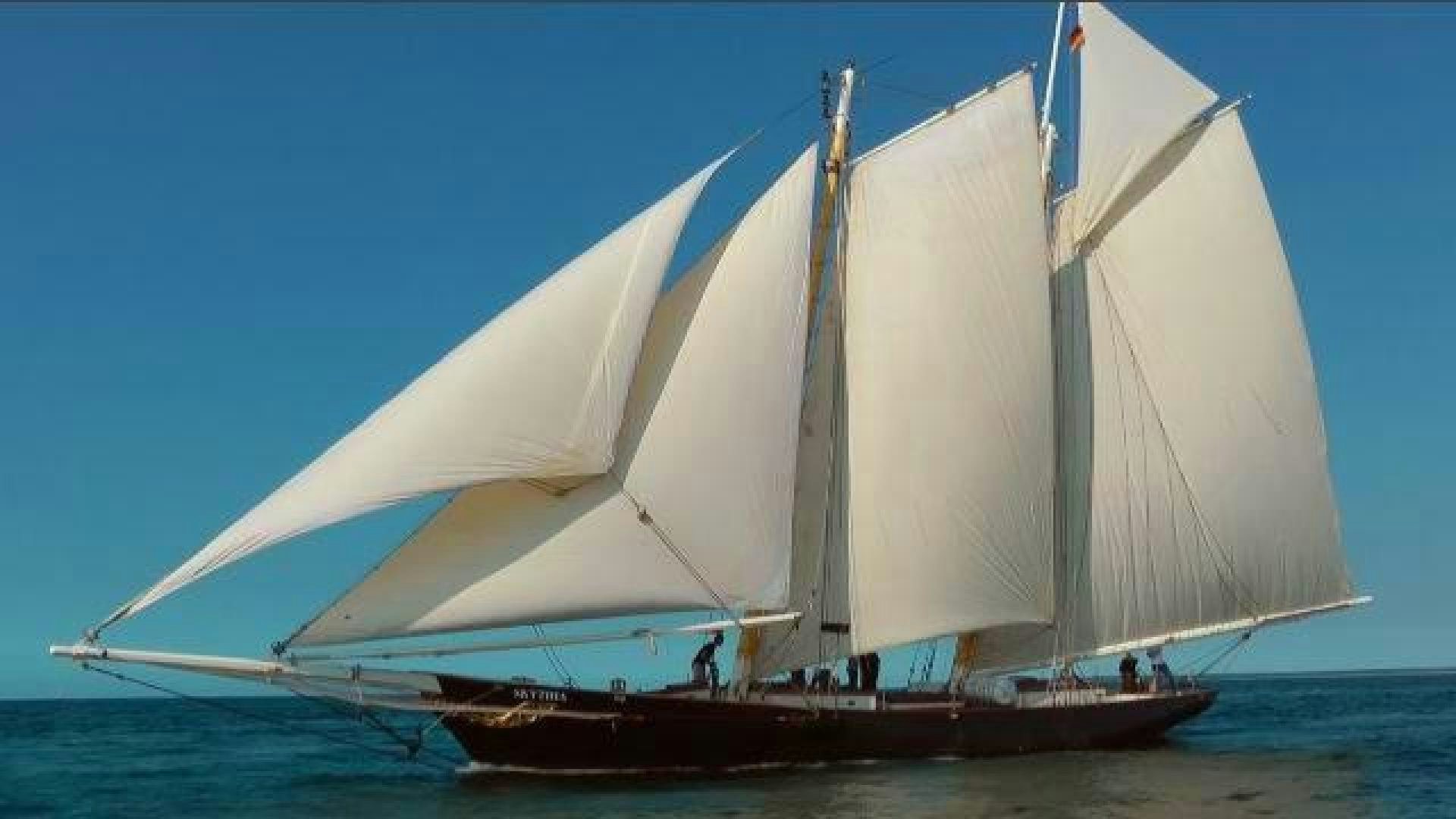 a sailboat on the water aboard SKYTHIA Yacht for Sale