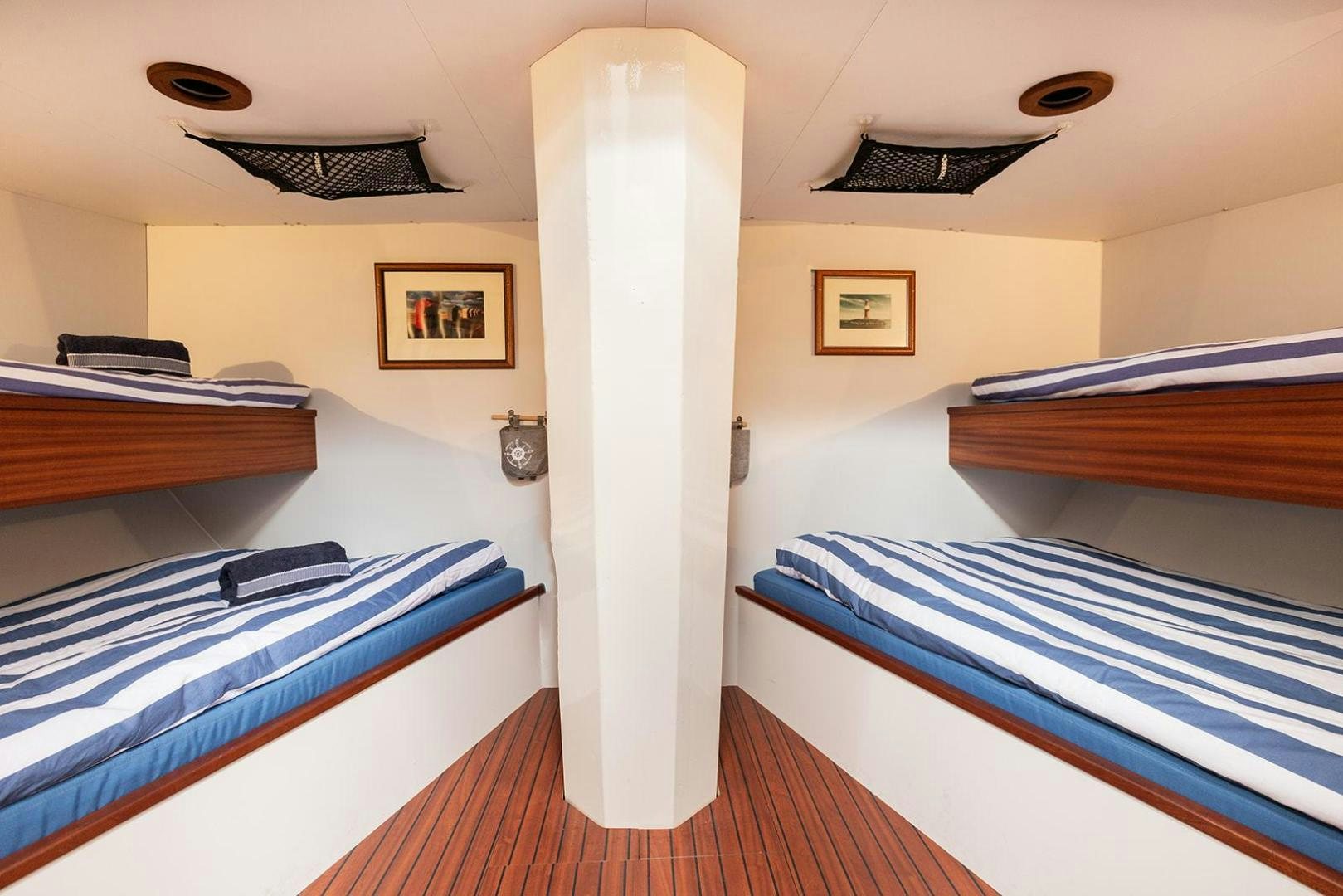 a room with bunk beds aboard SKYTHIA Yacht for Sale