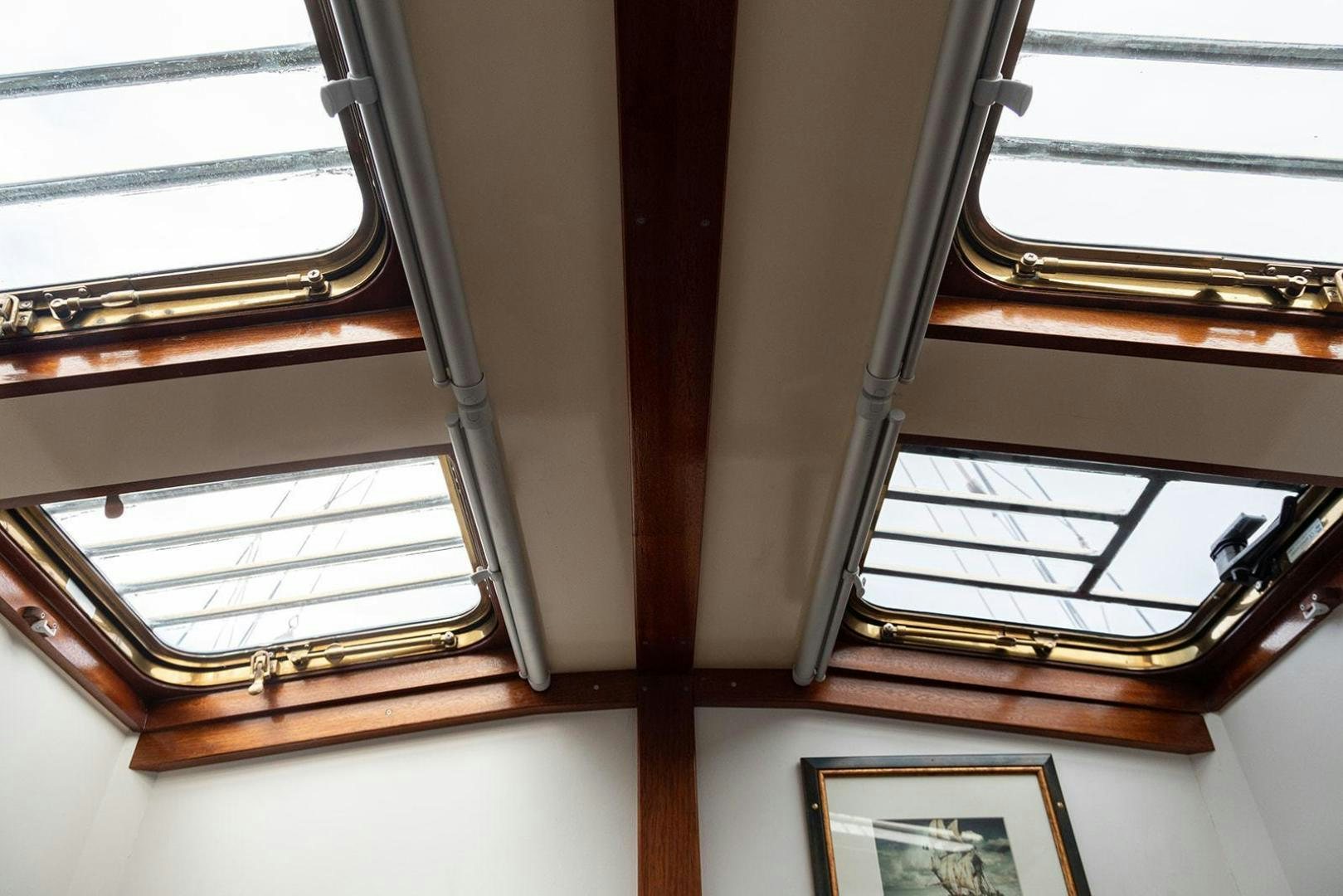 a window with a picture on it aboard SKYTHIA Yacht for Sale