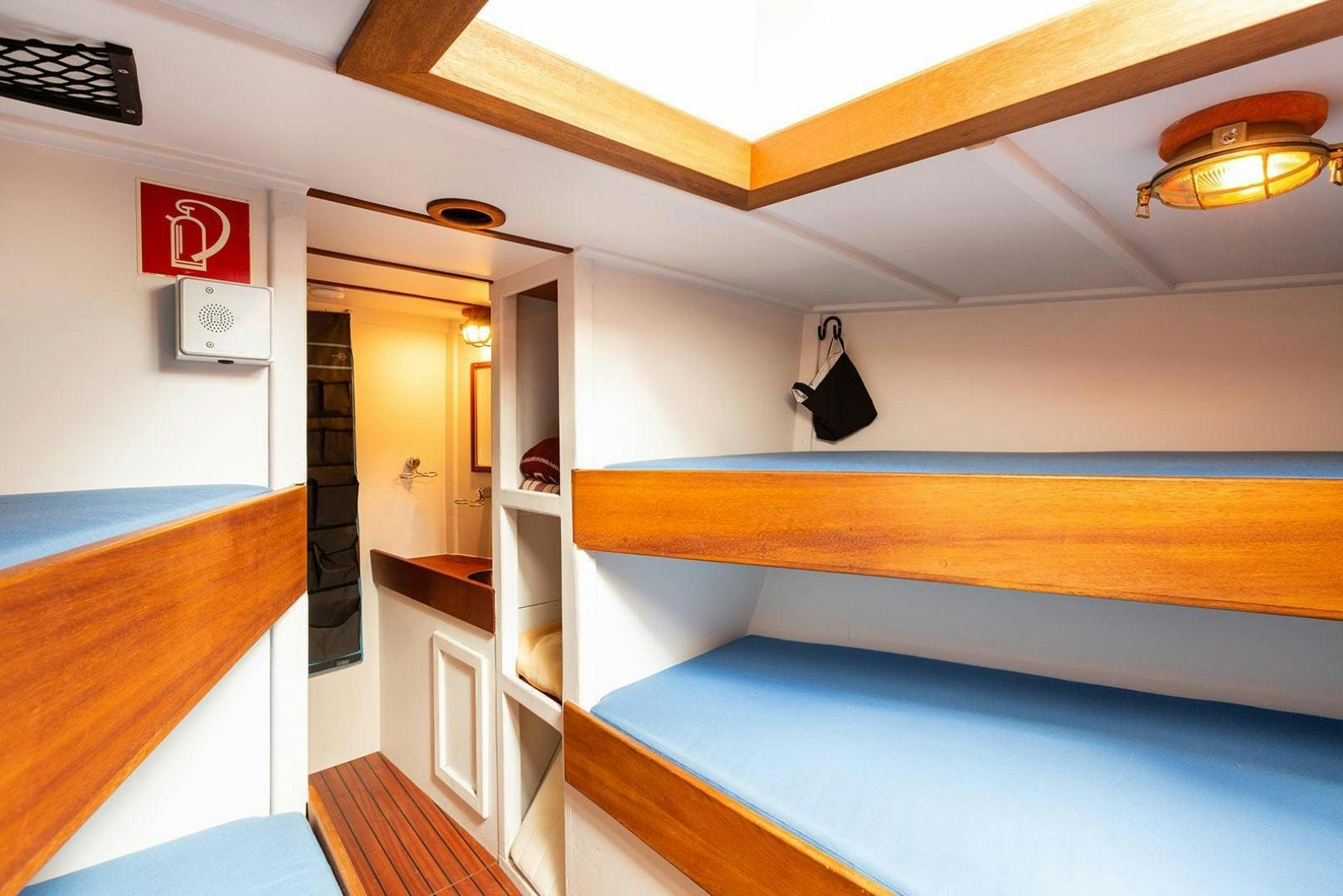 a room with a bunk bed and a desk aboard SKYTHIA Yacht for Sale