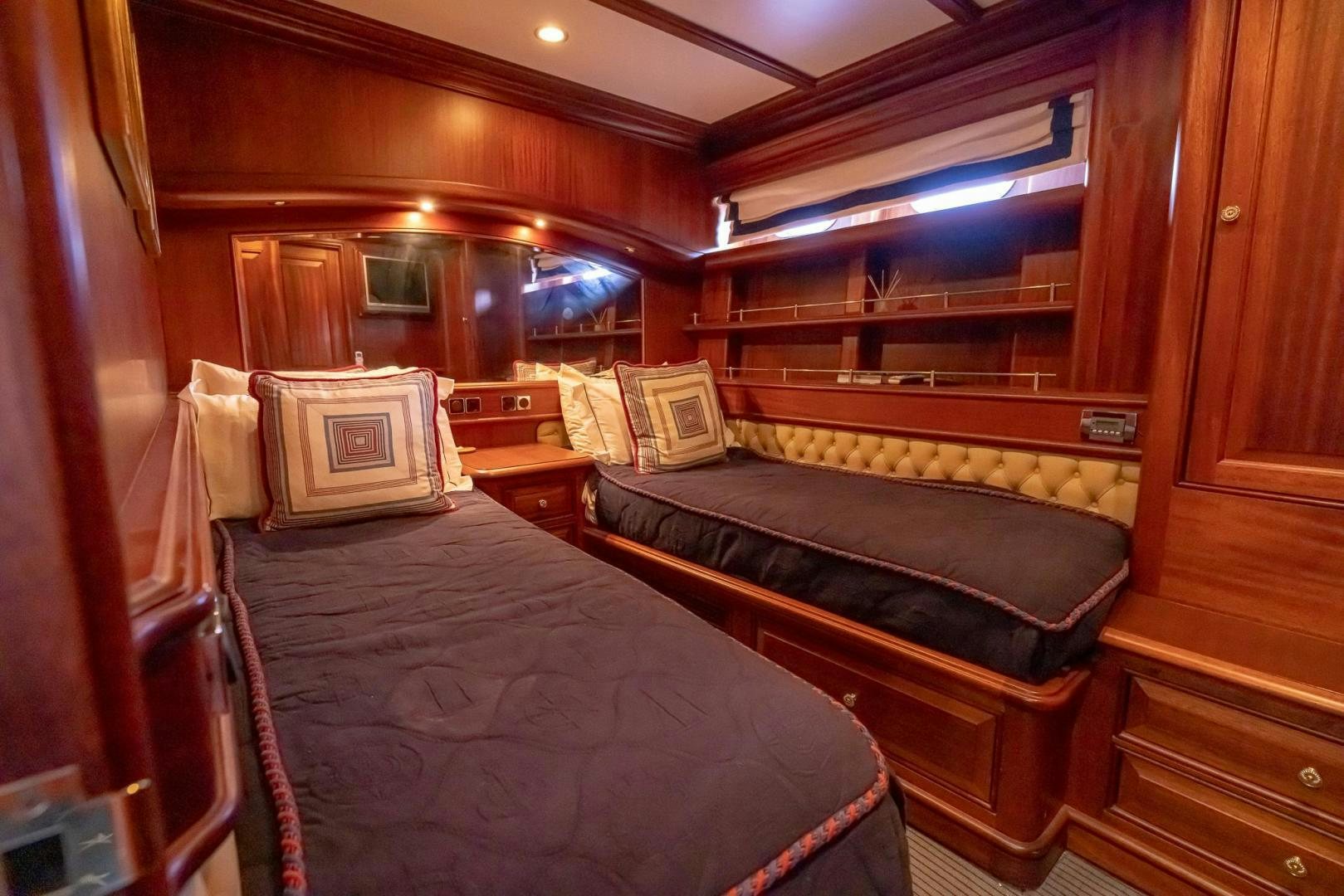 a room with two beds aboard ESSENCE OF CAYMAN Yacht for Sale