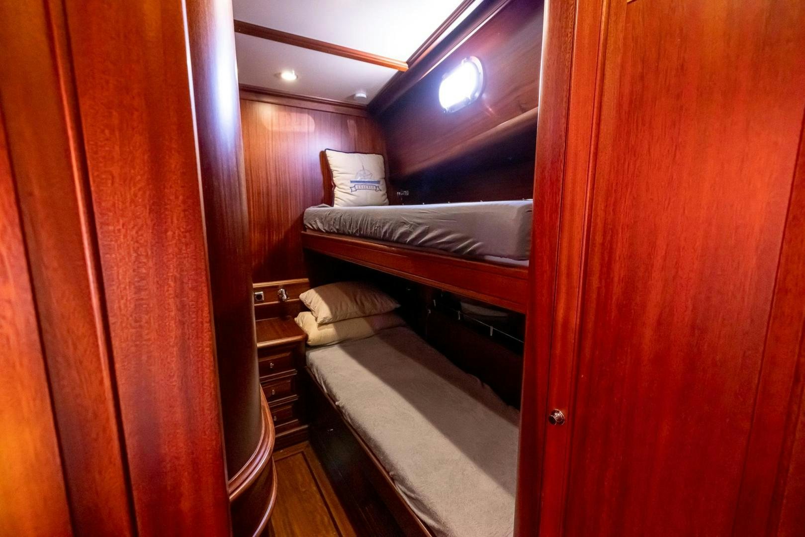 a room with bunk beds aboard ESSENCE OF CAYMAN Yacht for Sale