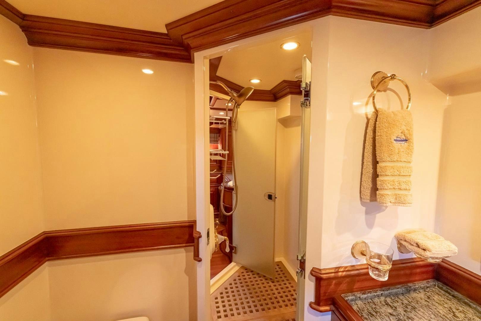 a bathroom with a large mirror aboard ESSENCE OF CAYMAN Yacht for Sale