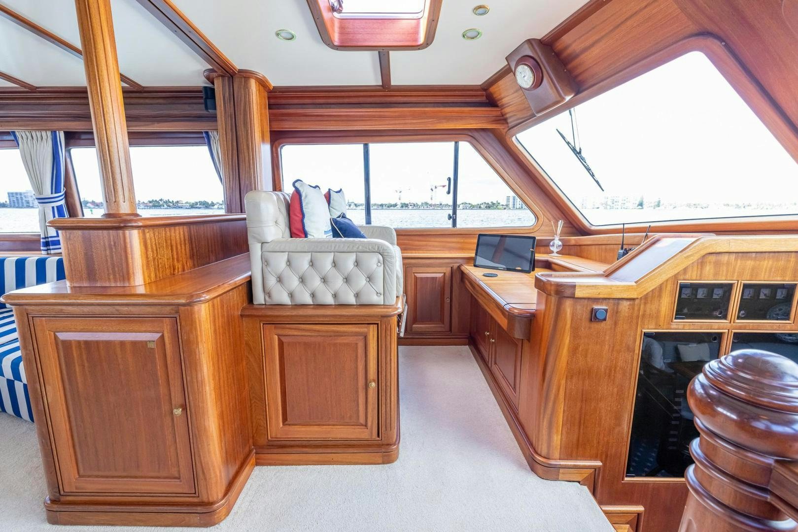 a room with a bed and desk aboard ESSENCE OF CAYMAN Yacht for Sale