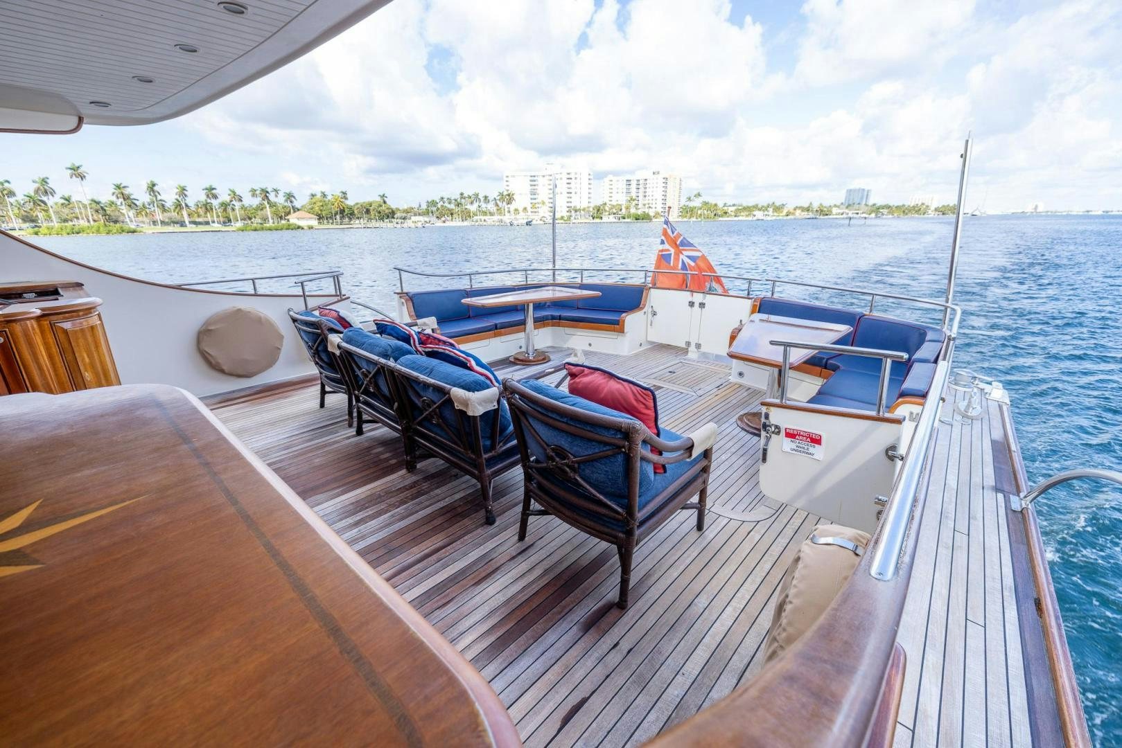 a boat dock with chairs and tables aboard ESSENCE OF CAYMAN Yacht for Sale