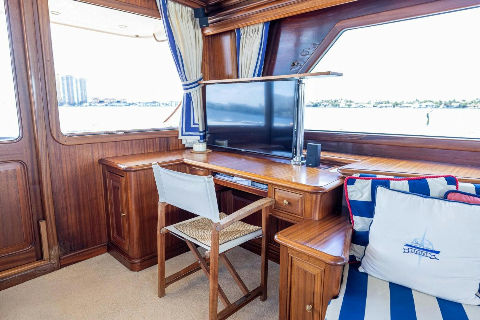 a room with a desk and a tv aboard ESSENCE OF CAYMAN Yacht for Sale
