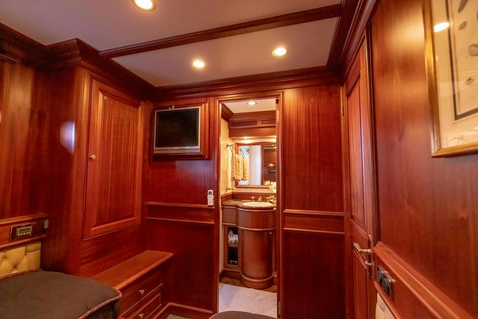 a room with wooden cabinets aboard ESSENCE OF CAYMAN Yacht for Sale