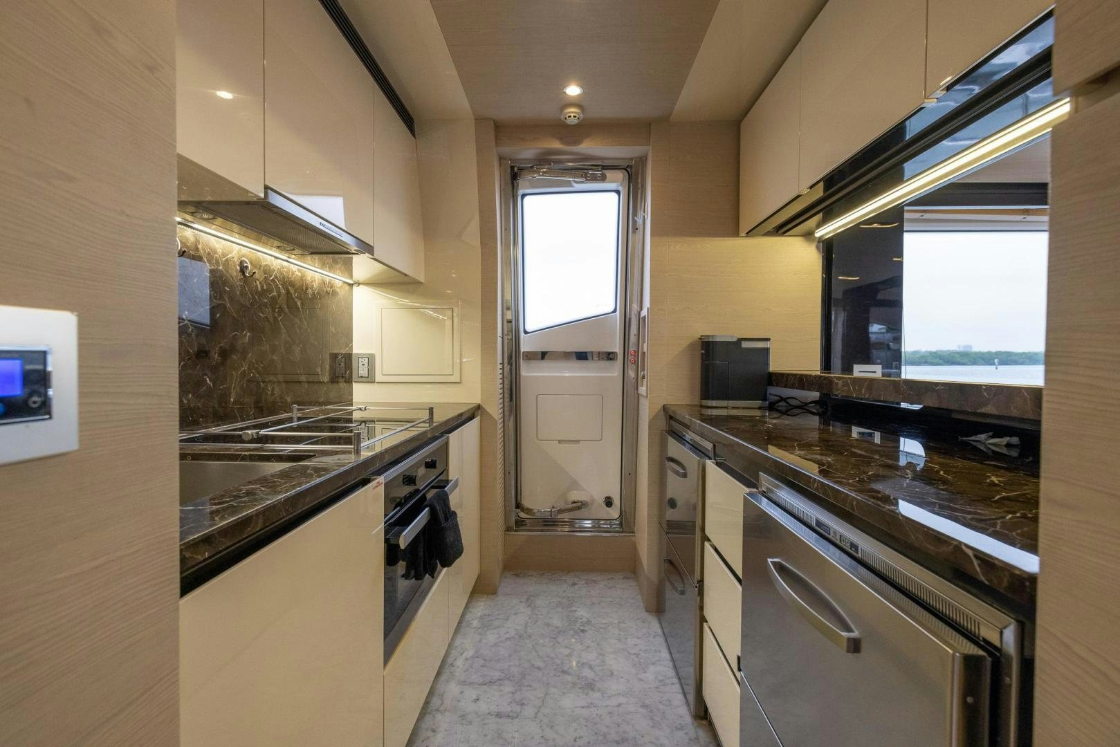 a kitchen with a stove and oven aboard HAPPY HOURS Yacht for Sale