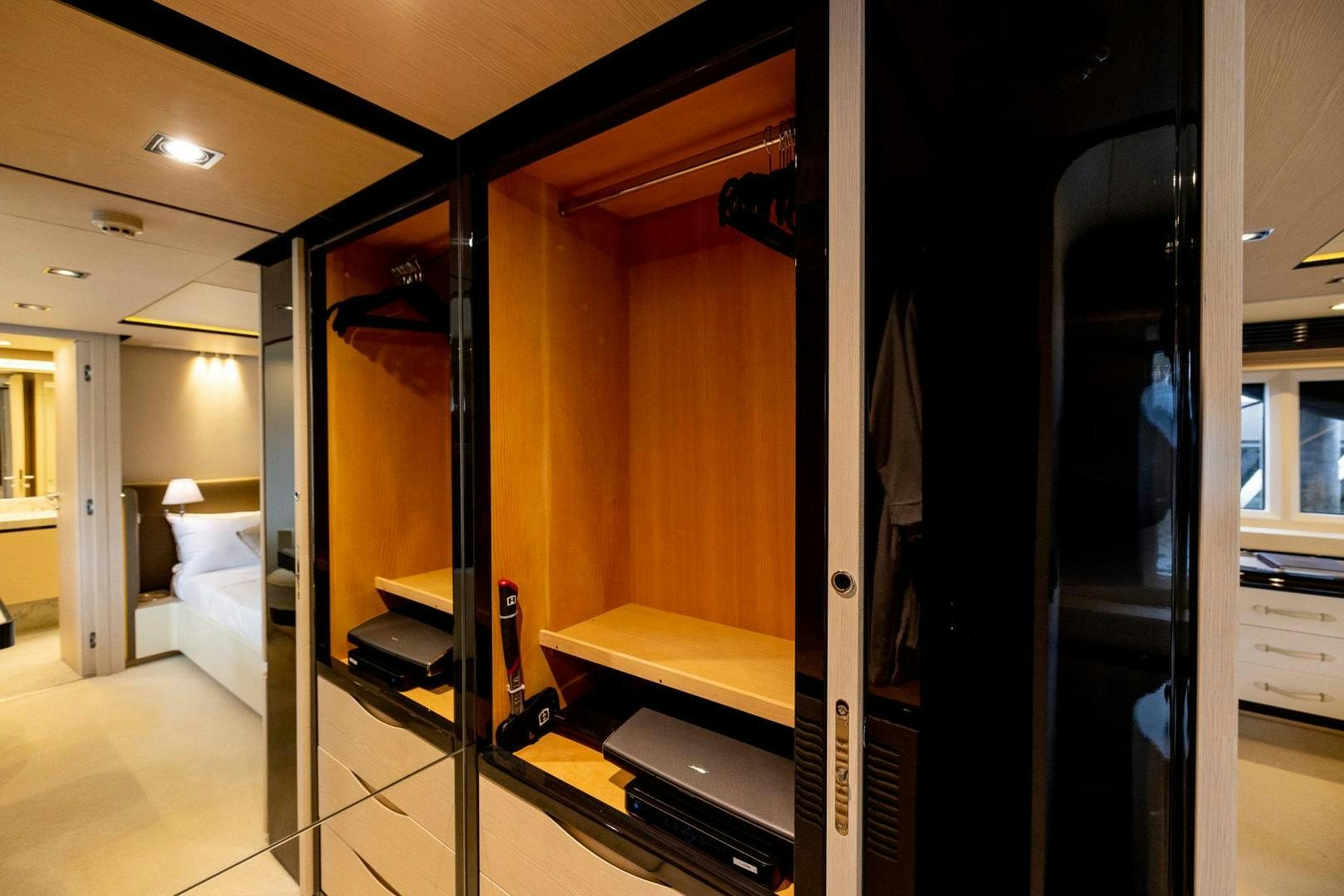 a room with a bed and a closet aboard HAPPY HOURS Yacht for Sale