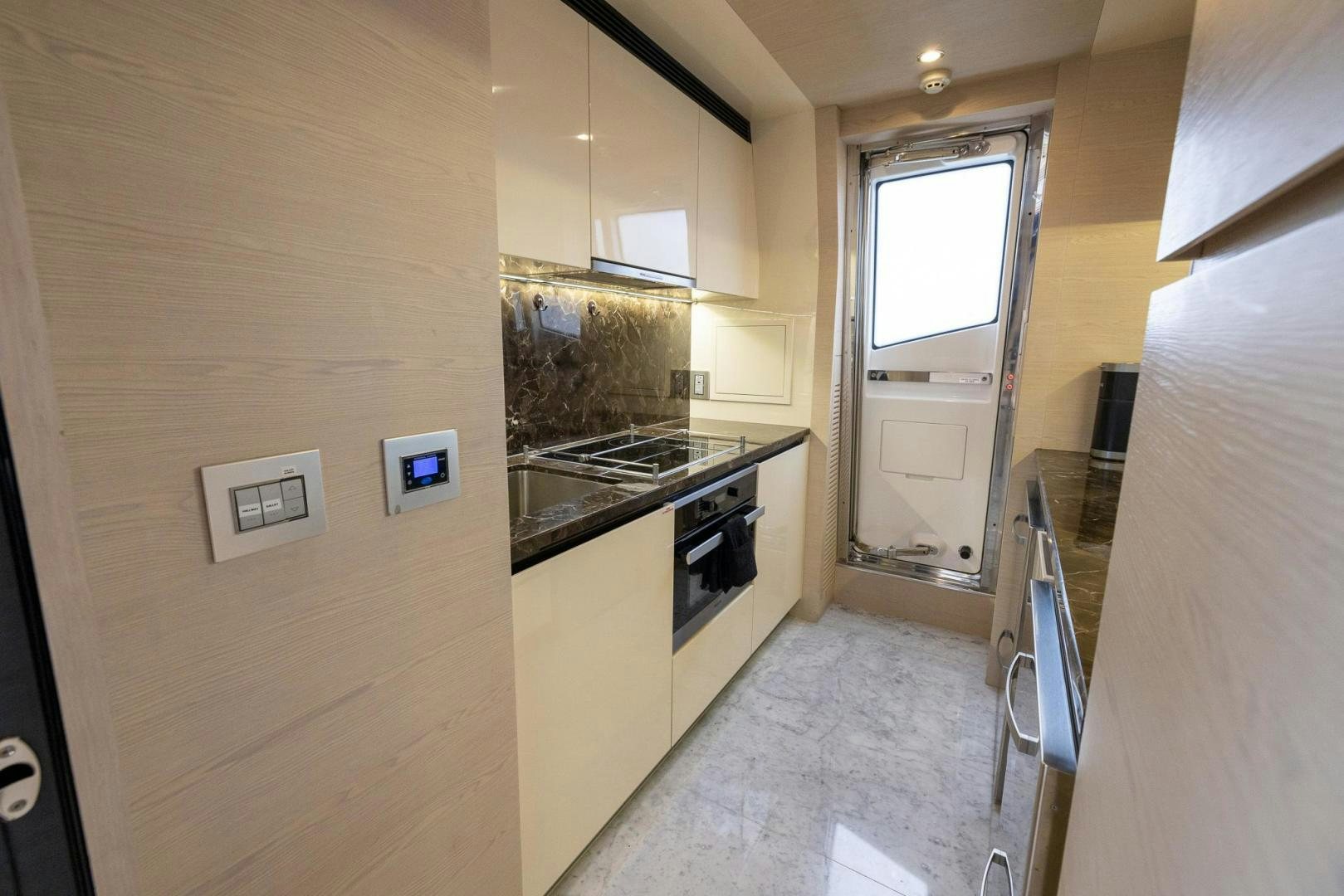 a kitchen with a stove and oven aboard HAPPY HOURS Yacht for Sale