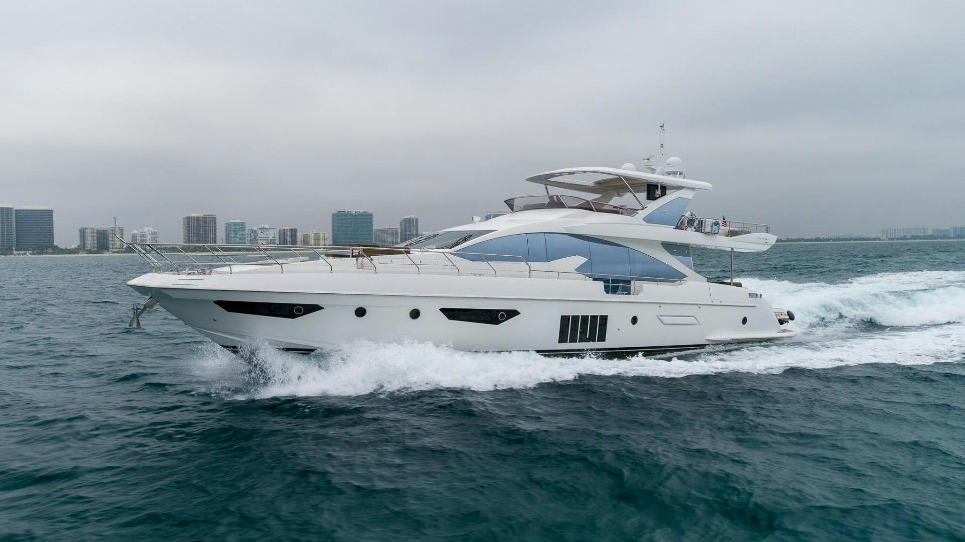 a white yacht in the water aboard HAPPY HOURS Yacht for Sale