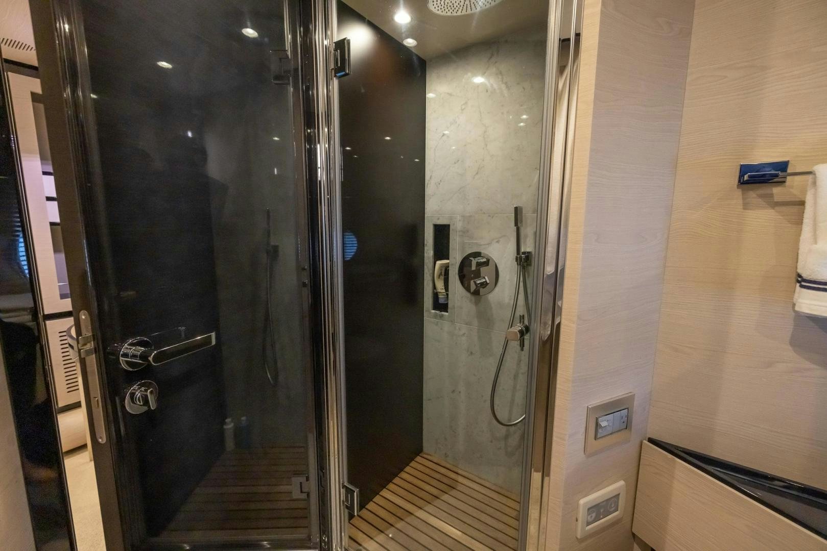 a large elevator with glass doors aboard HAPPY HOURS Yacht for Sale