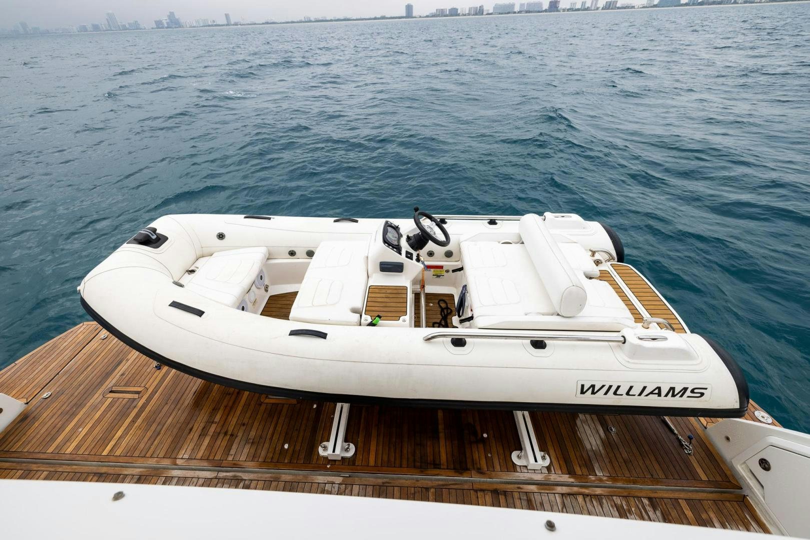 a white boat on a dock aboard HAPPY HOURS Yacht for Sale
