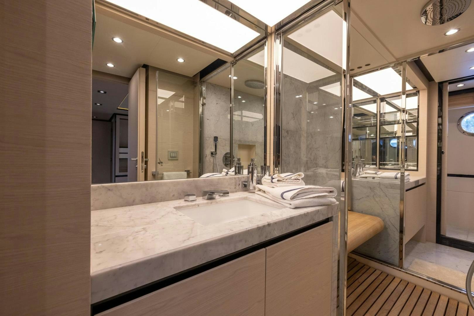 a bathroom with a large mirror aboard HAPPY HOURS Yacht for Sale