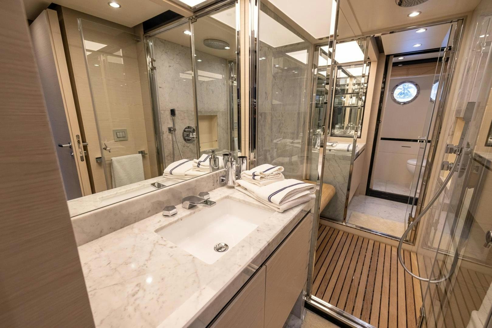 a bathroom with a large mirror aboard HAPPY HOURS Yacht for Sale
