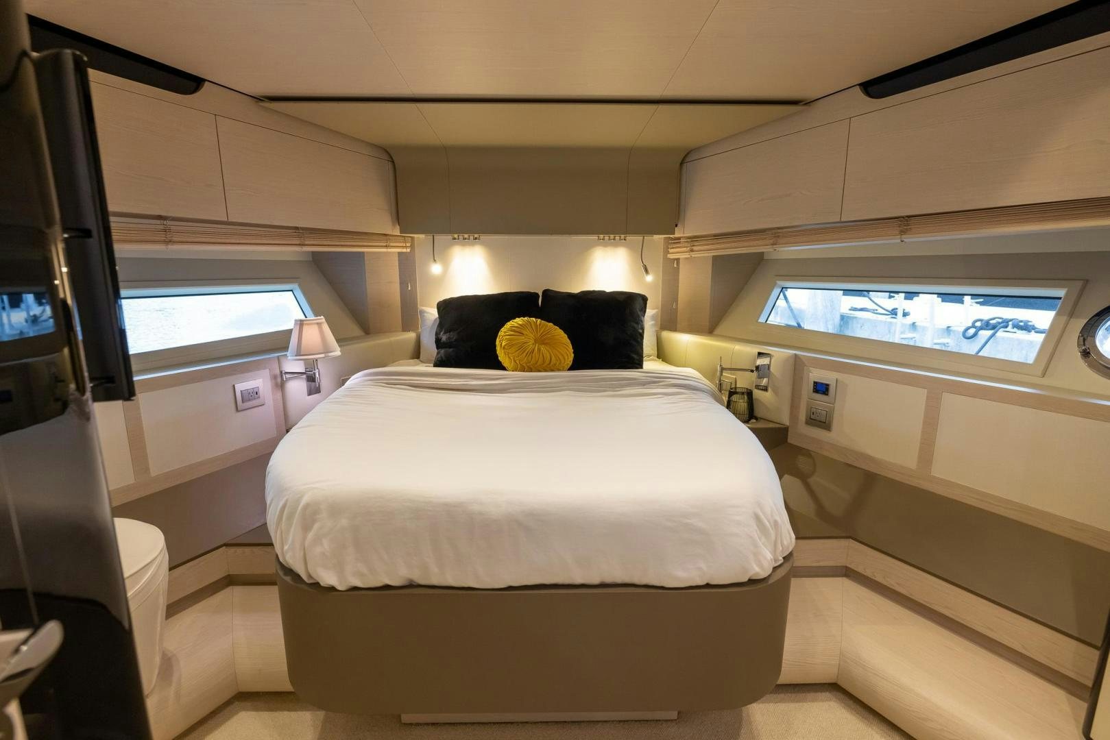 a small bedroom with a bed aboard HAPPY HOURS Yacht for Sale