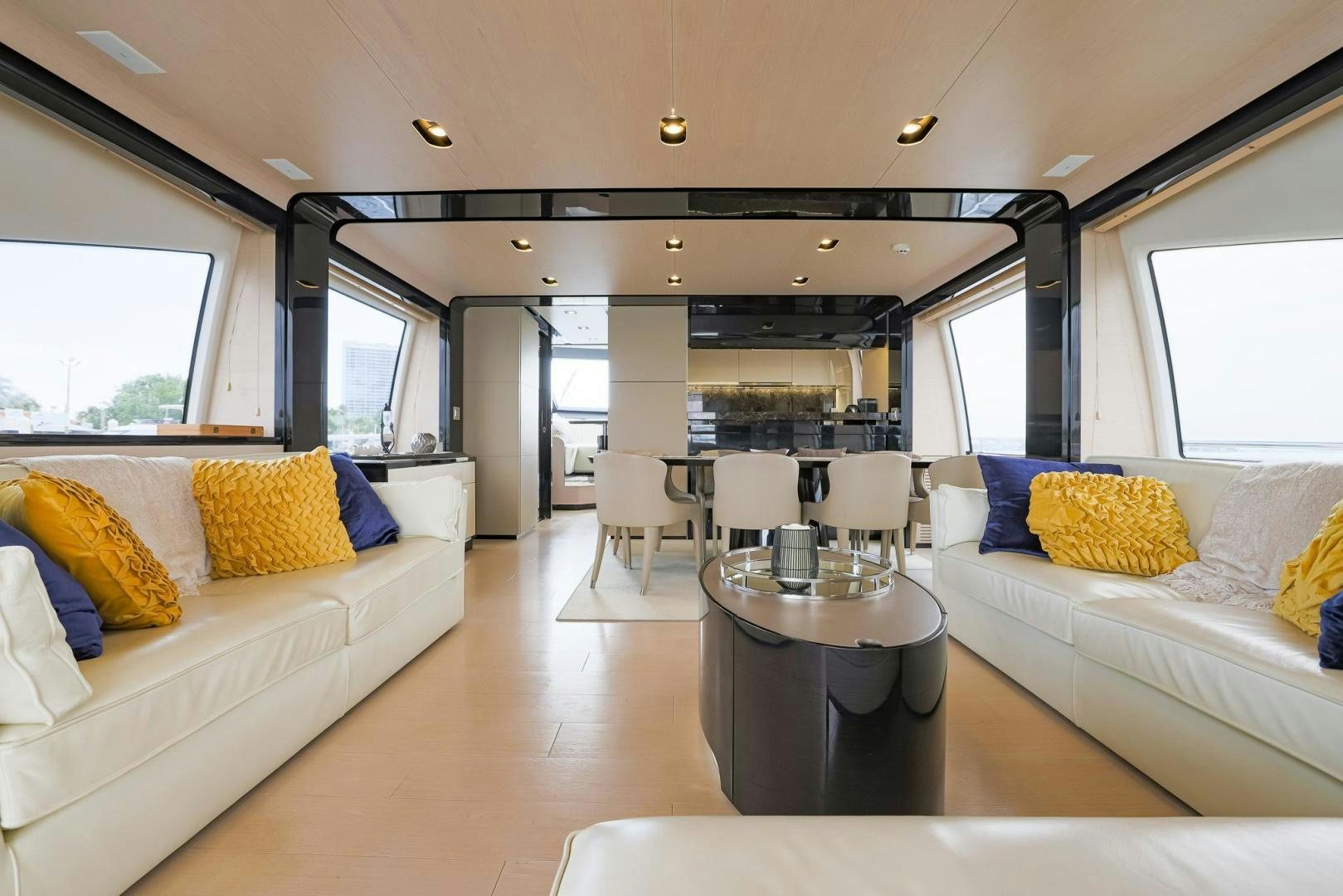 a living room with a couch and a table aboard HAPPY HOURS Yacht for Sale