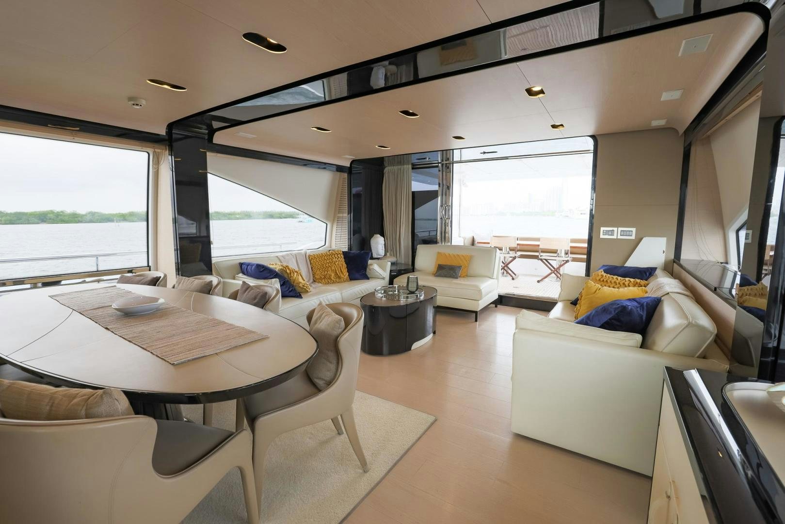 a living room with a large window aboard HAPPY HOURS Yacht for Sale