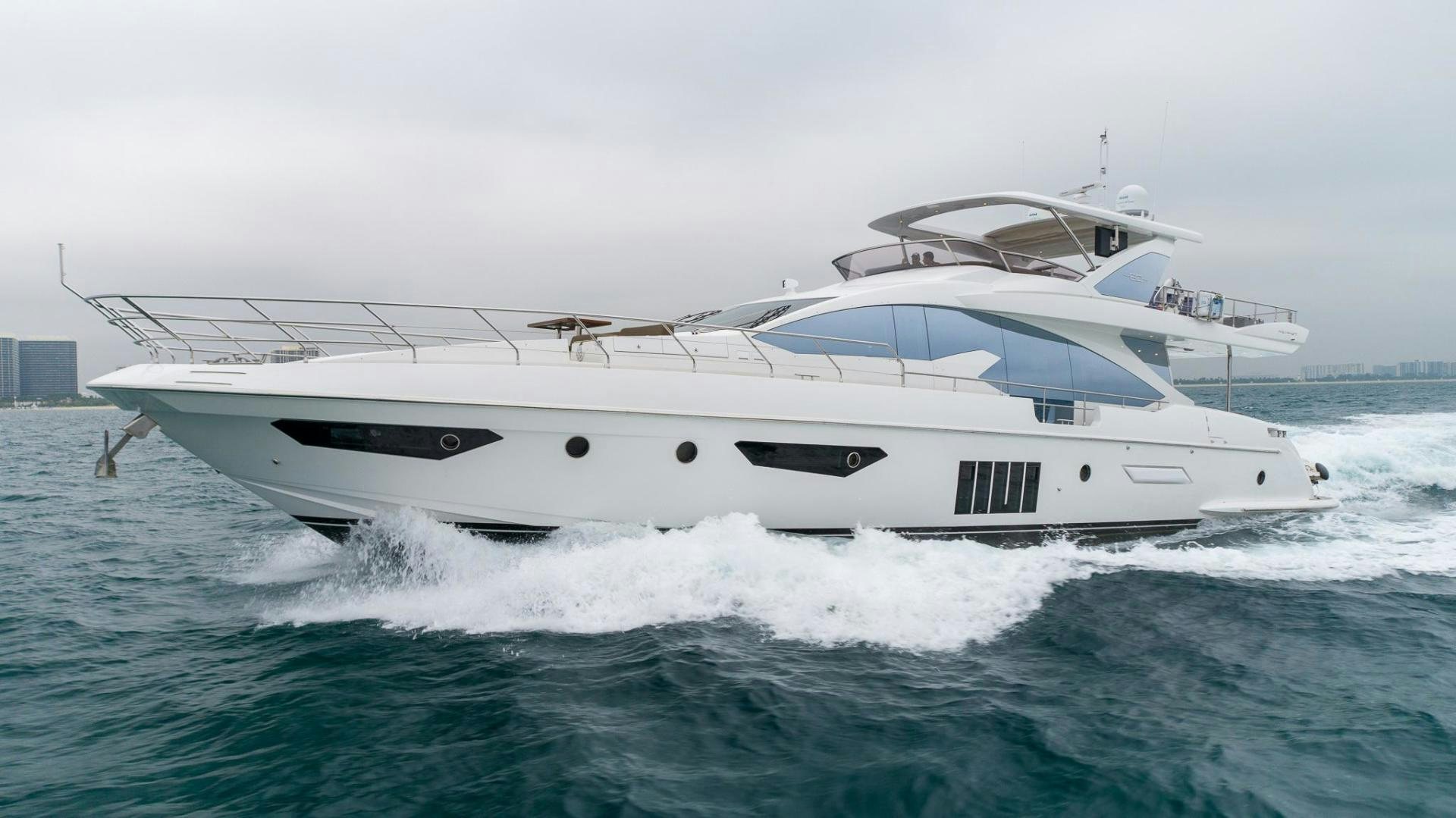 a white yacht in the water aboard HAPPY HOURS Yacht for Sale