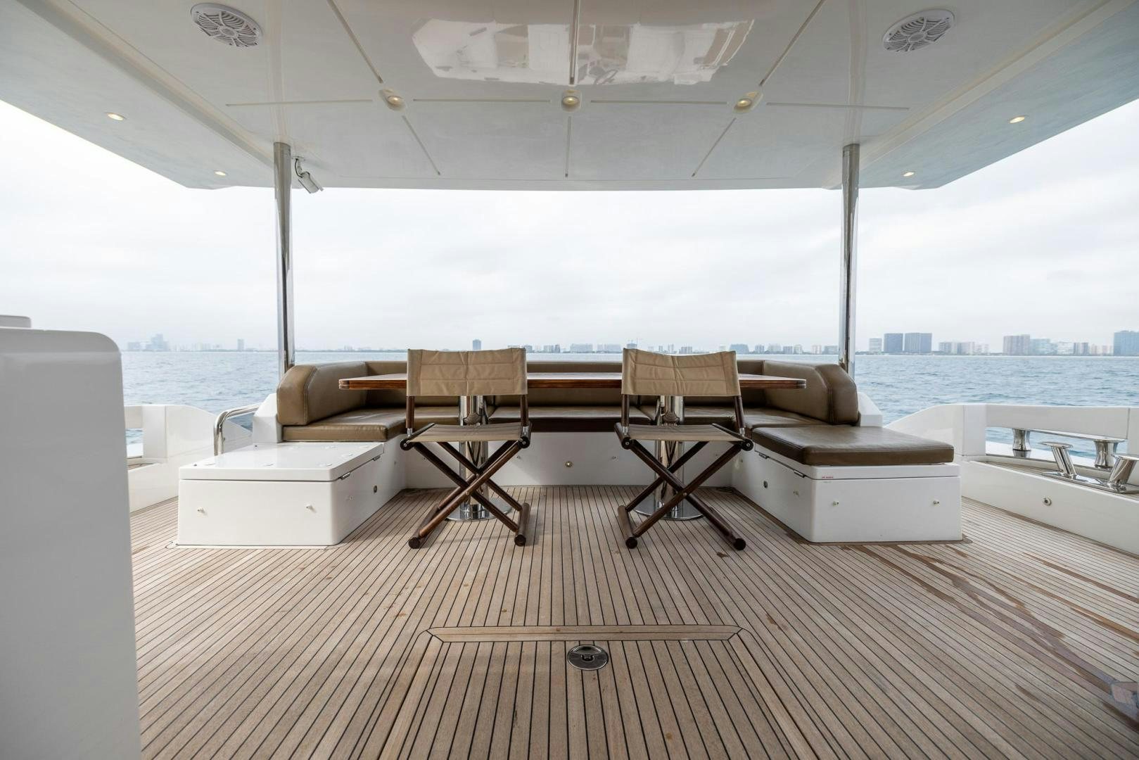 a room with a table and chairs aboard HAPPY HOURS Yacht for Sale