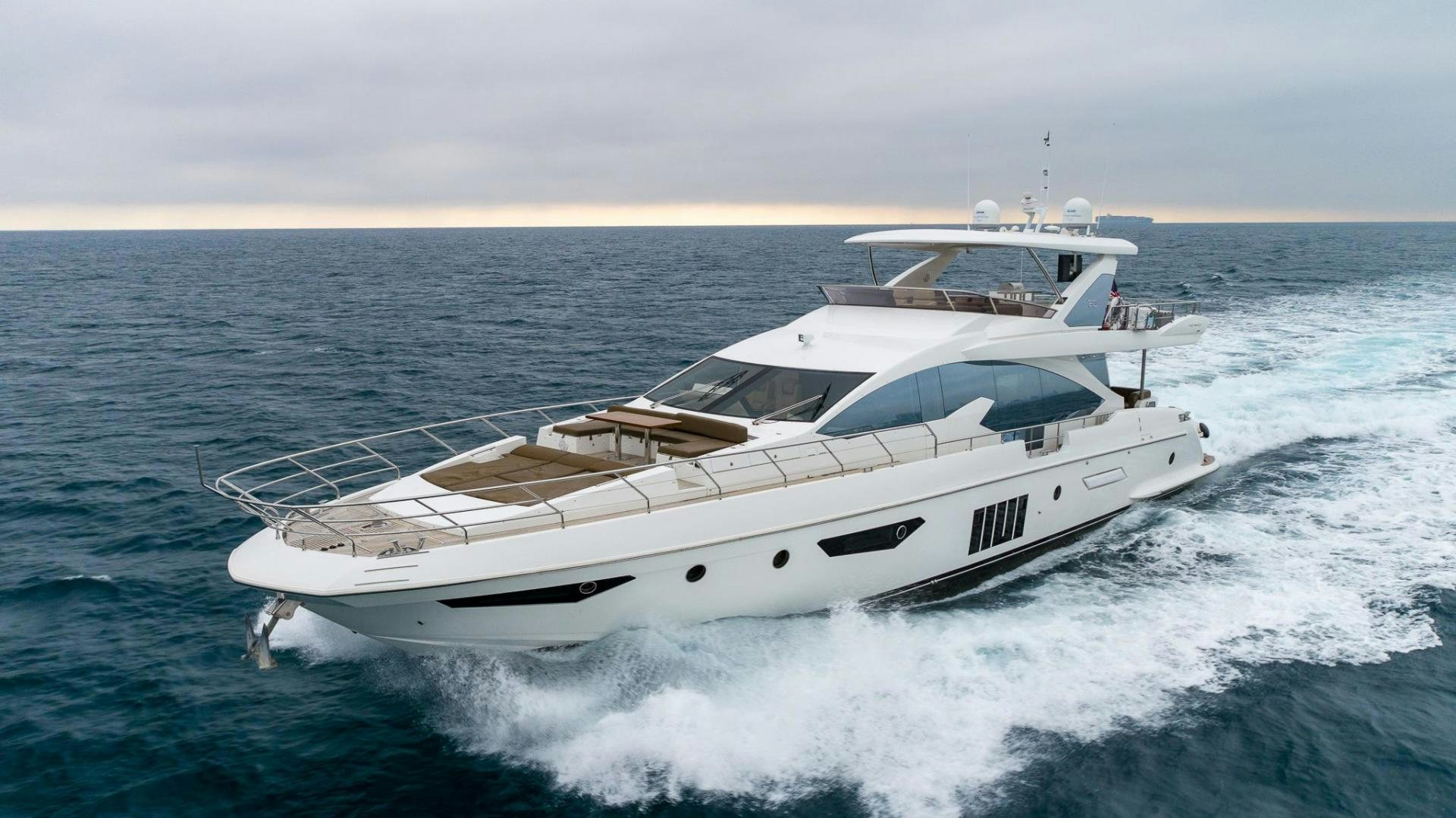 a yacht on the water aboard HAPPY HOURS Yacht for Sale