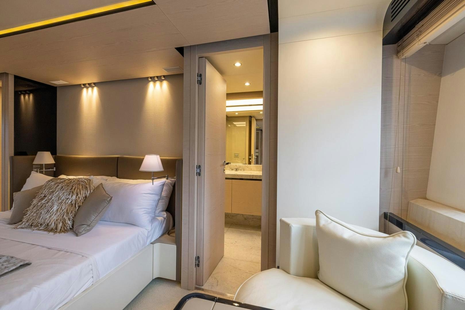 a hotel room with a bed and a mirror aboard HAPPY HOURS Yacht for Sale