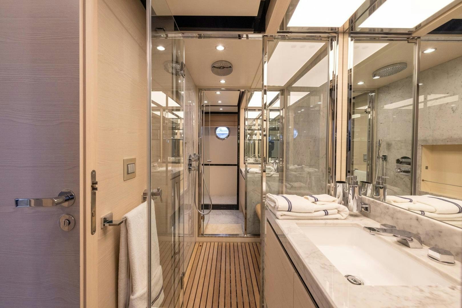 a bathroom with a sink and a mirror aboard HAPPY HOURS Yacht for Sale