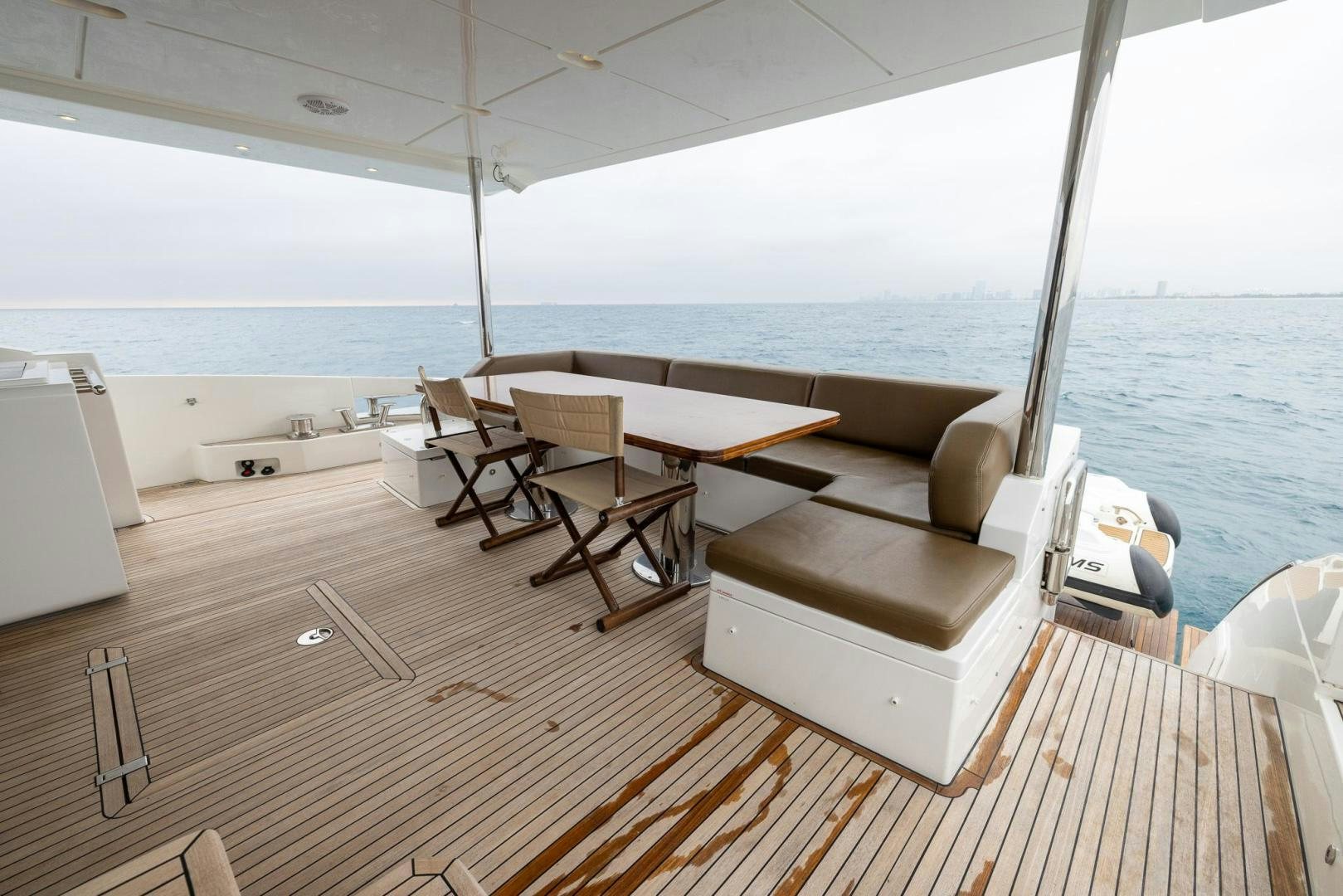 a room with a table and chairs aboard HAPPY HOURS Yacht for Sale