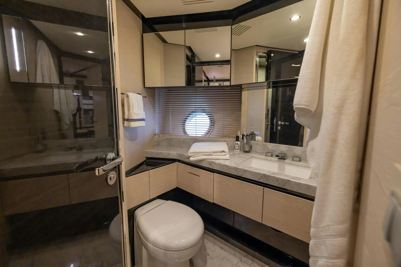 a bathroom with a sink and toilet aboard HAPPY HOURS Yacht for Sale