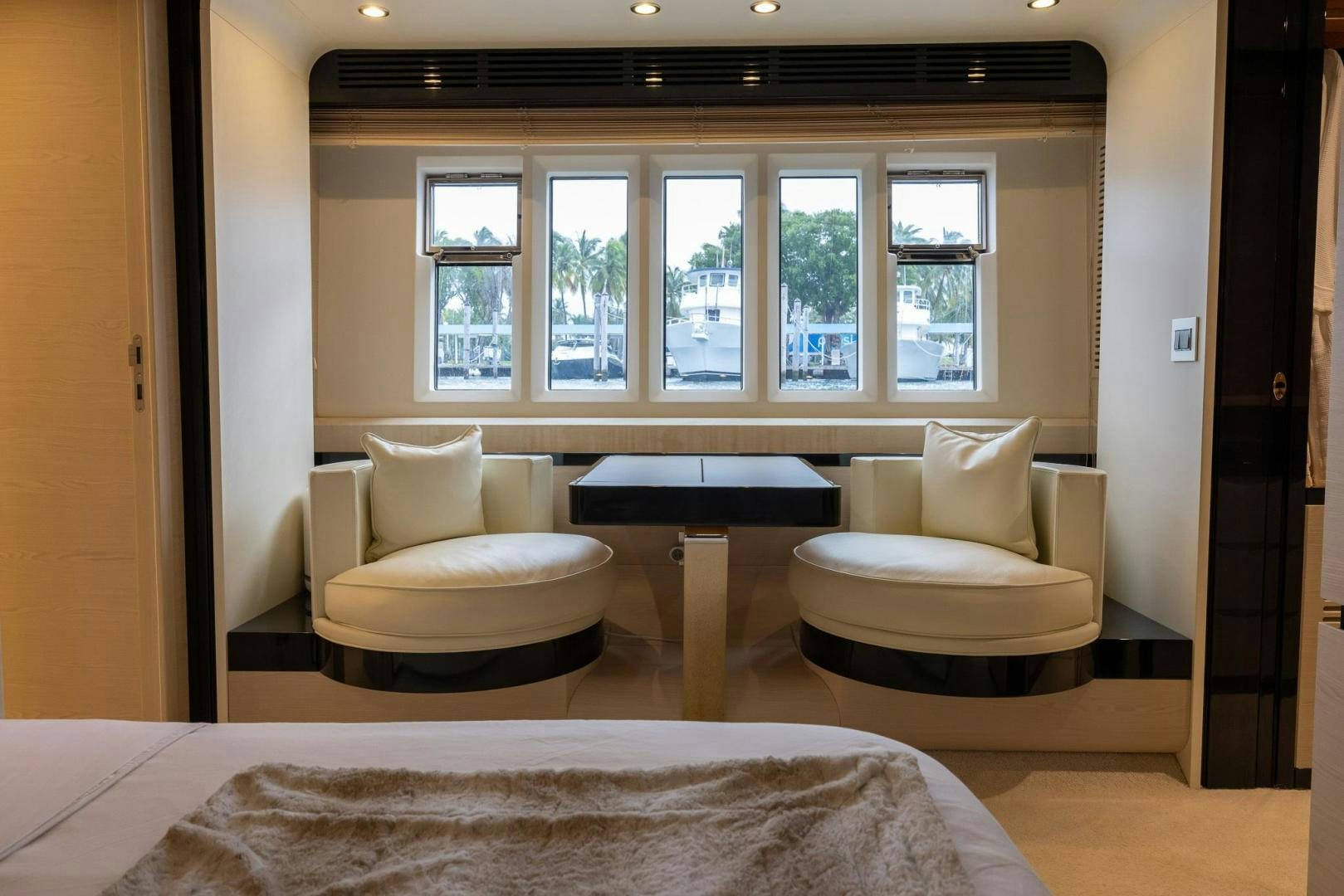 a room with a bed and a table aboard HAPPY HOURS Yacht for Sale