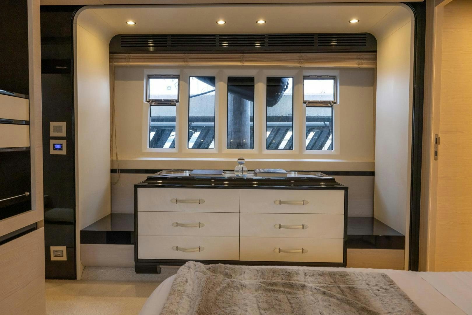 a room with a bed and a dresser aboard HAPPY HOURS Yacht for Sale