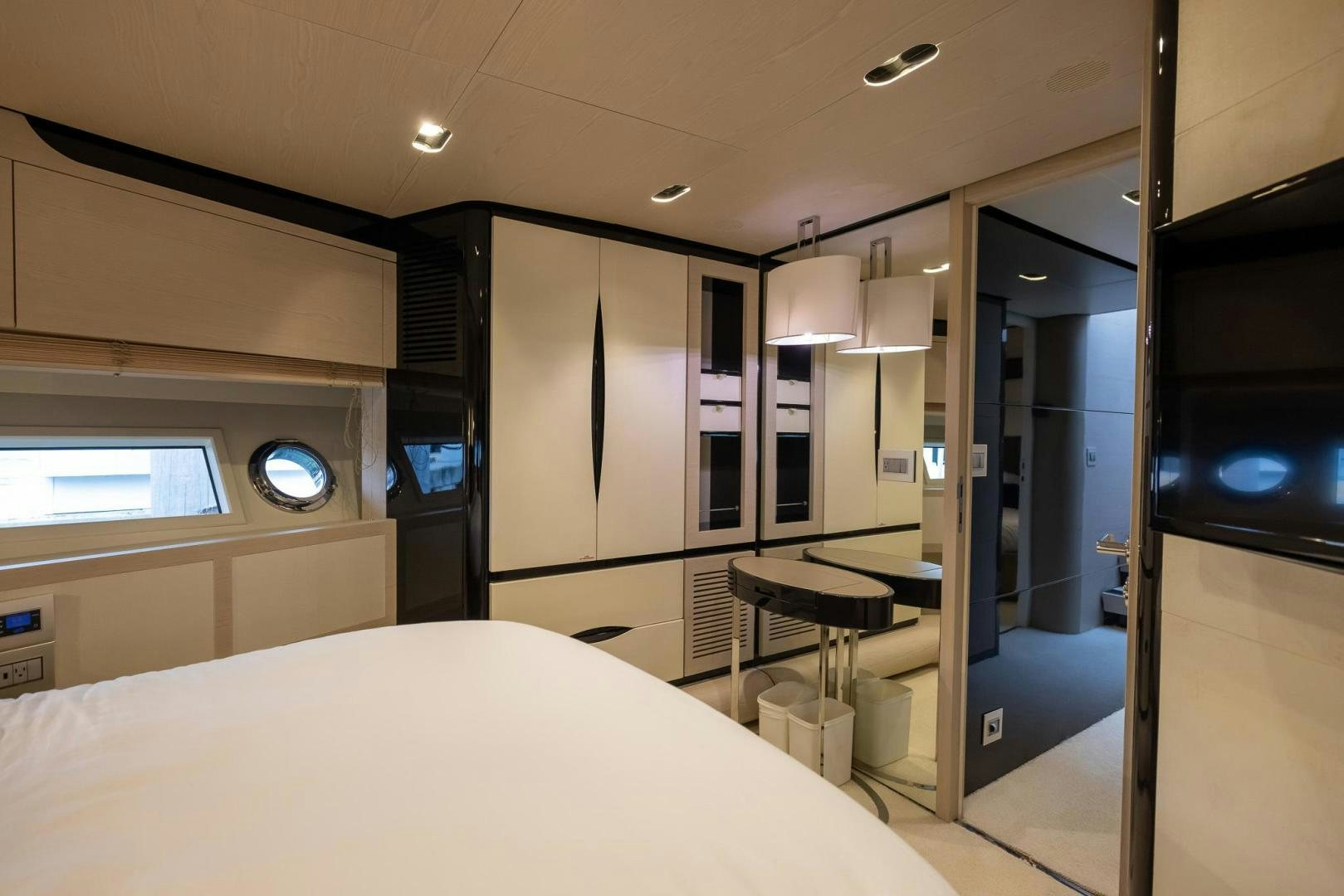 a room with a bed and desk aboard HAPPY HOURS Yacht for Sale