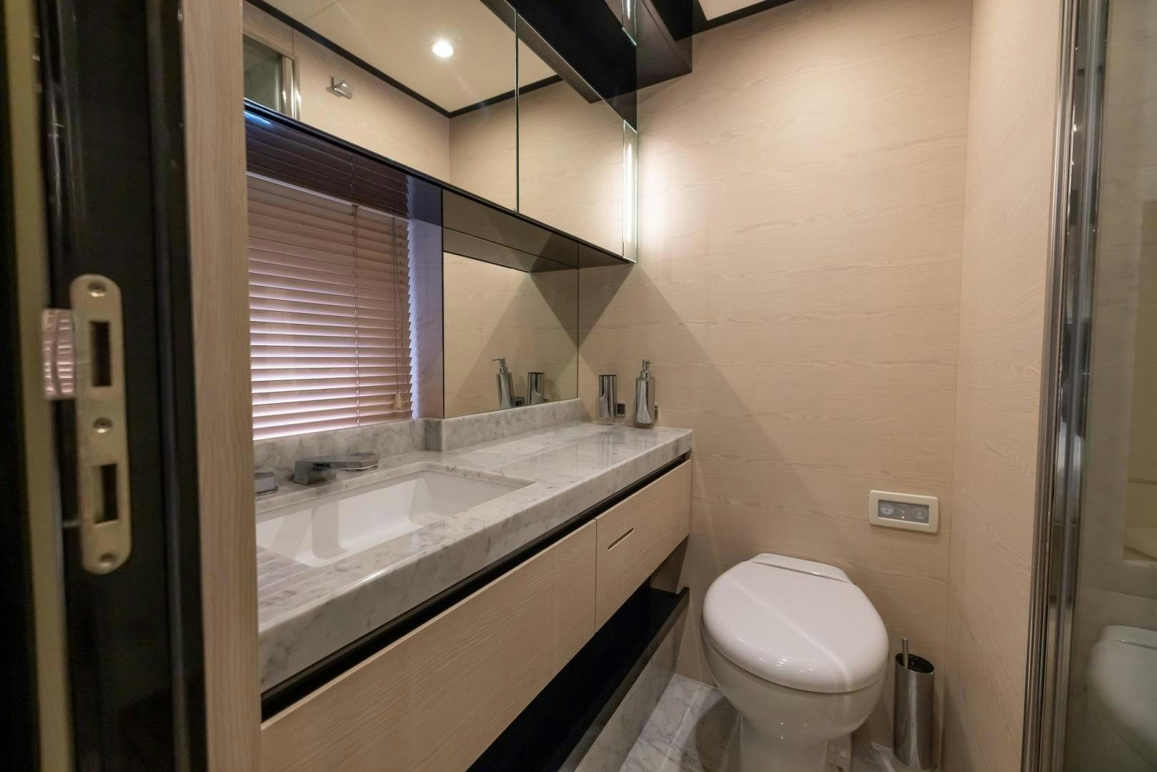 a bathroom with a sink and a toilet aboard HAPPY HOURS Yacht for Sale