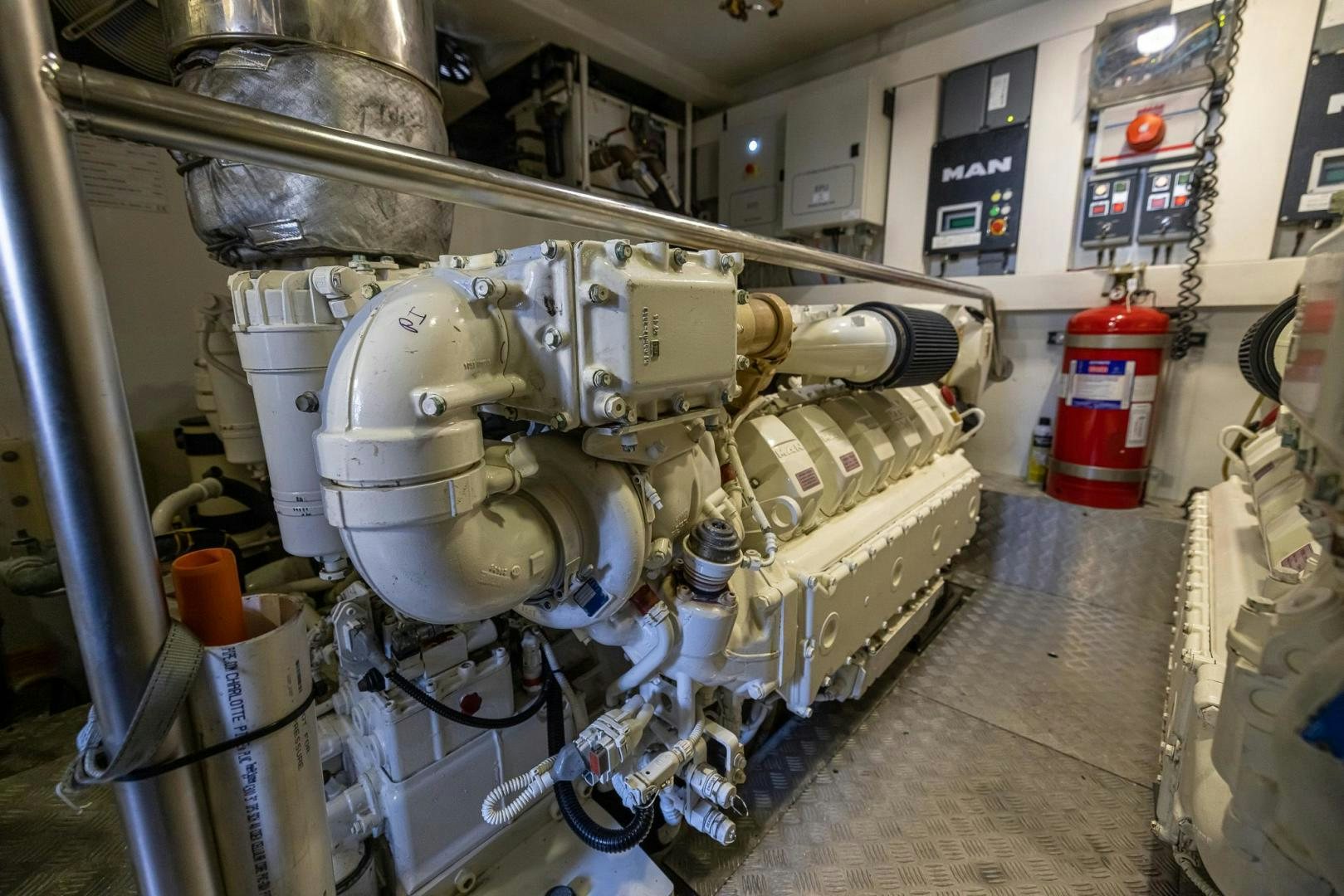 a large machine with a large metal cylinder aboard HAPPY HOURS Yacht for Sale